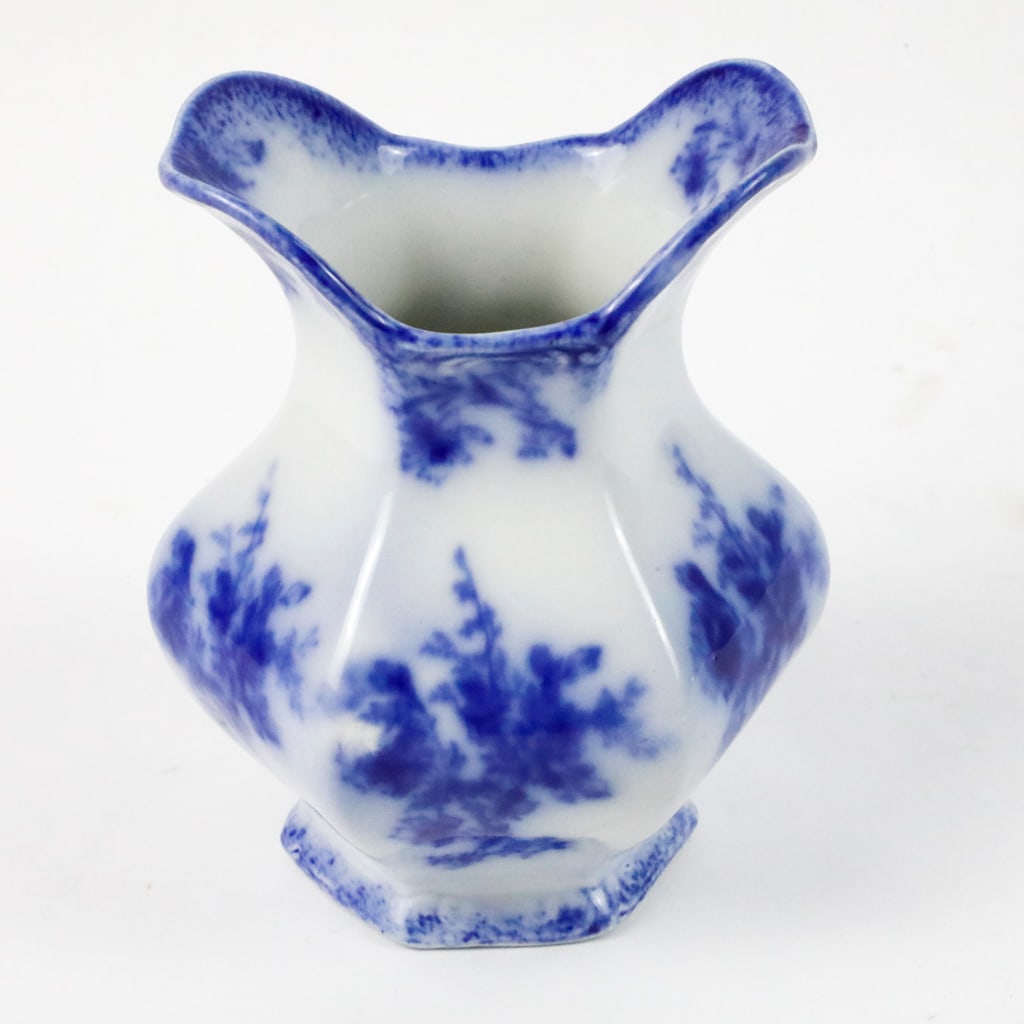 Antique W. H. Grindley Flow Blue Vanity Vase: Antique flow blue hexagonal vanity vase/toothbrush holder in the "Doreen" pattern by W. H. Grindley, with sprays of floral on each panel. Size: 5.5"h
