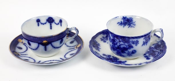 Two Flow Blue Teacups and Saucers