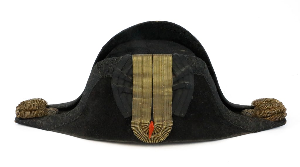 Bicorne Military Hat, Late 1790s, with Red and Gold Ribbon Rosette and Labeled Jolliffe and Sons: Bicorne hat worn by European and American military officers in late 1790s during Napoleonic period. Hat features a cockade, red and gold ribbon rosette to show to show country. Hat is also referred to