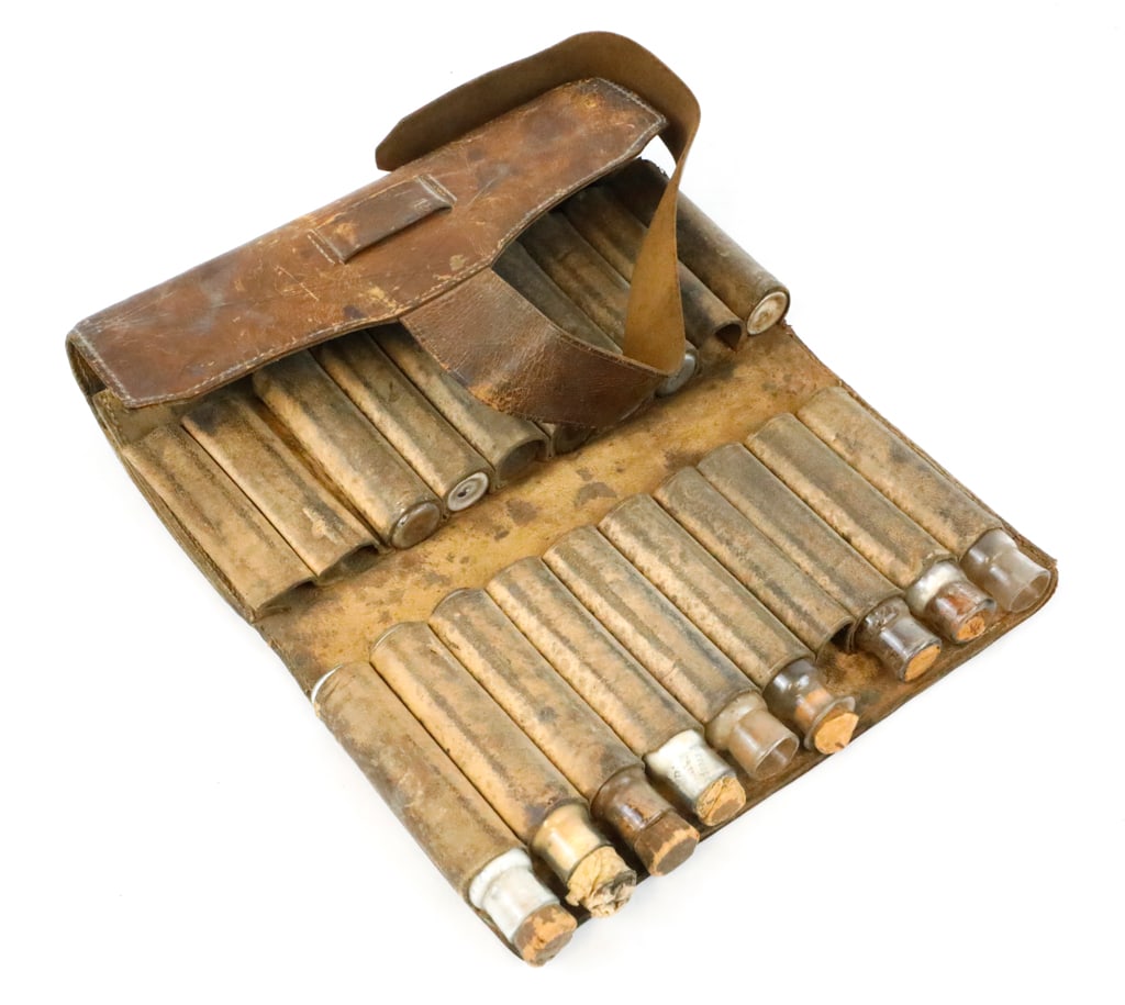 Leather Medical Pouch with Powdered Medicine Vials for Traveling Apothecary or Doctor: Leather medical pouch for carrying 20 vials of powdered medicine for traveling apothecary or doctor. Leather strap holds the folding case together. Leather worn and some corks worn and missing. Size: 