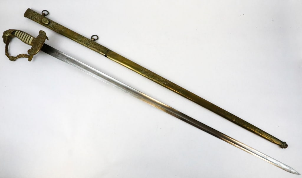 U.S. Eagle Head Militia Officers Sword Circa 1830s Engraved NP Ames/Cutler/ Springfield with Brass: U.S. eagle head militia officers sword is circa 1830s and manufactured by NP Ames. The hilt is made of brass and has mother-of-pearl grip panels bound with twisted brass wire. Two of the top panels by