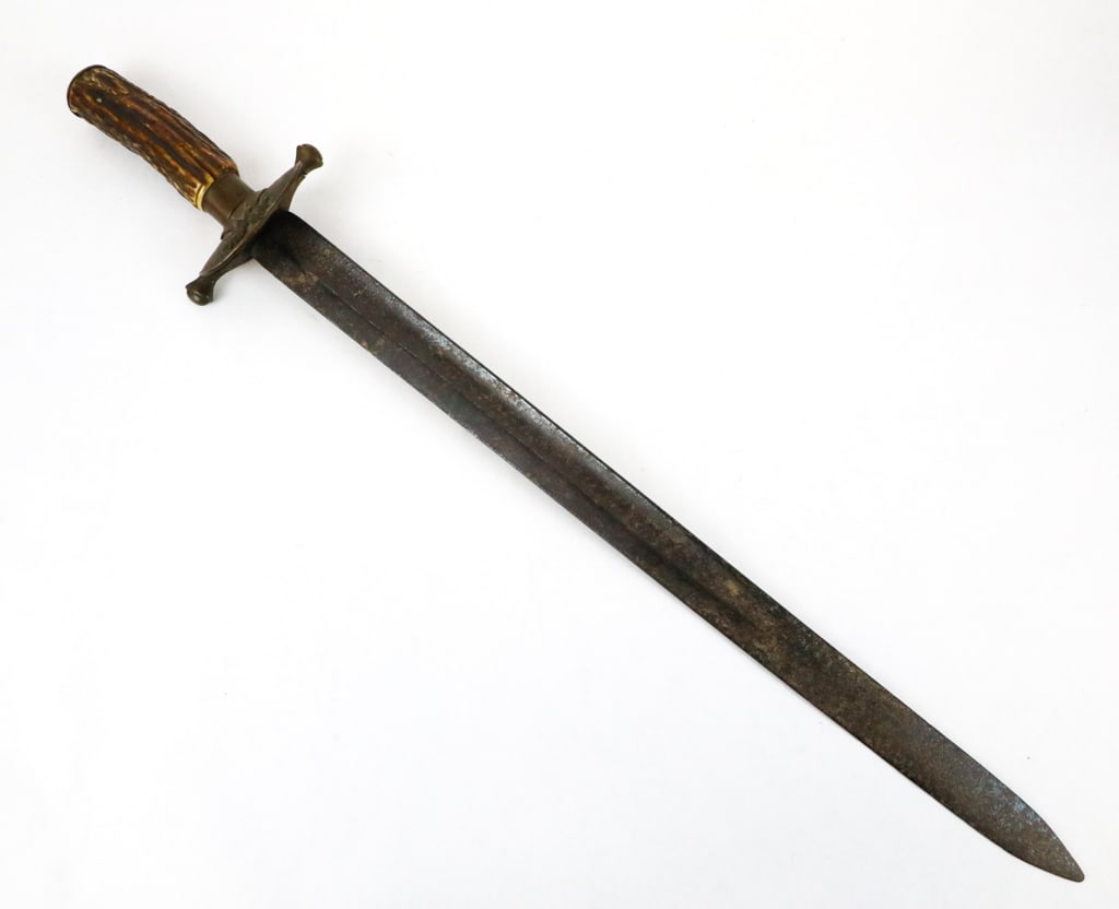 Hunting Style Sword with Antler Grip: Hunting style sword with antler grip and earlier small turned down counter guard. There is an applied eagle attached to the guard. The blade is likely that of a rifle saber bayonet which is heavily pi
