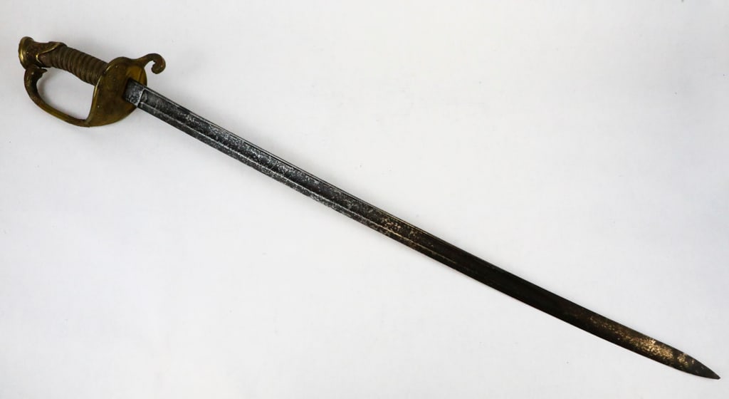 U.S. M. 1852 Naval Officers Sword: U.S. M. 1852 naval officers sword. The sword is unmarked and is likely a German import. The grip is sharkskin covered with brass wire that is mostly intact with a small piece missing by the pommel. Th