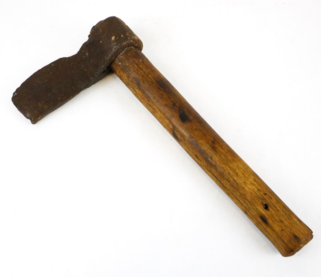Antique Colonial-Era Hand Axe: Colonial era axe that is well worn and hand-forged. It has a broad rectangular head with visible hammer marks throughout. It is mounted on its original aged hardwood handle. The iron has developed a d