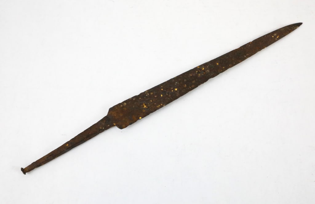 Colonial Tapered Spear Point: Colonial-Era spear point made from an old file. The iron spear point displays hammer marks and deep patina. It is rusted and pitted throughout. Size: 12.50"l