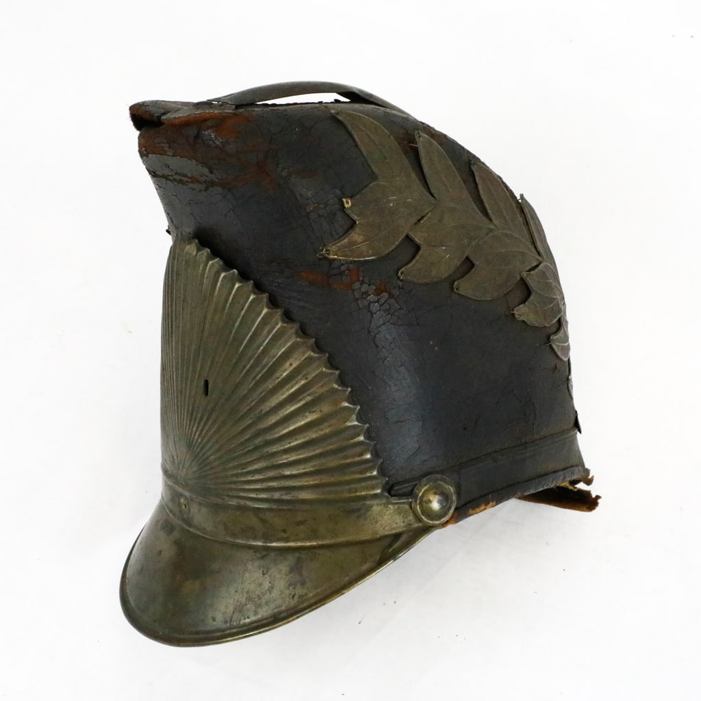Circa 1840 Dragoon Helmet: Circa 1840 dragoon helmet. First troop Philadelphia City Cavalry. The shako helmet shows a metallic sunburst on the front, and a laurel wreath on each side. The helmet shows leather behind the sunburs