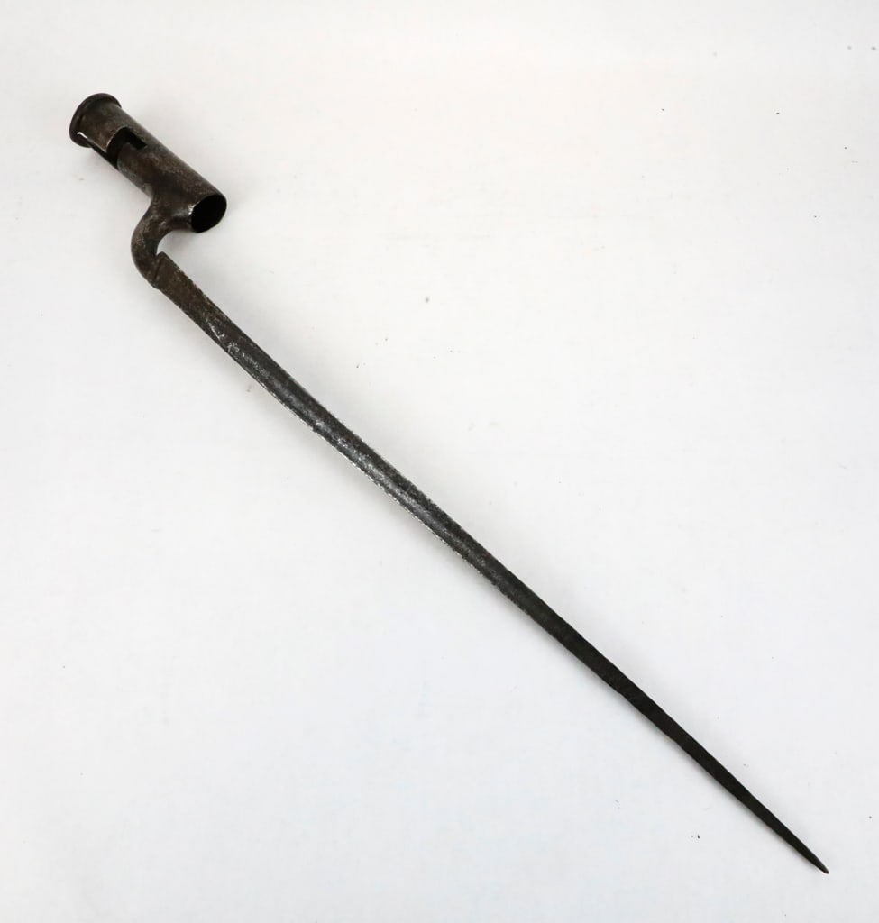 Early 1800's Brown Bess Socket Musket Bayonet: Early 1800's socket musket bayonet, "Brown Bess" the Long Island pattern musket used by the British. The socket fits over the barrel of the musket- offset to allow the soldier to load with the musket