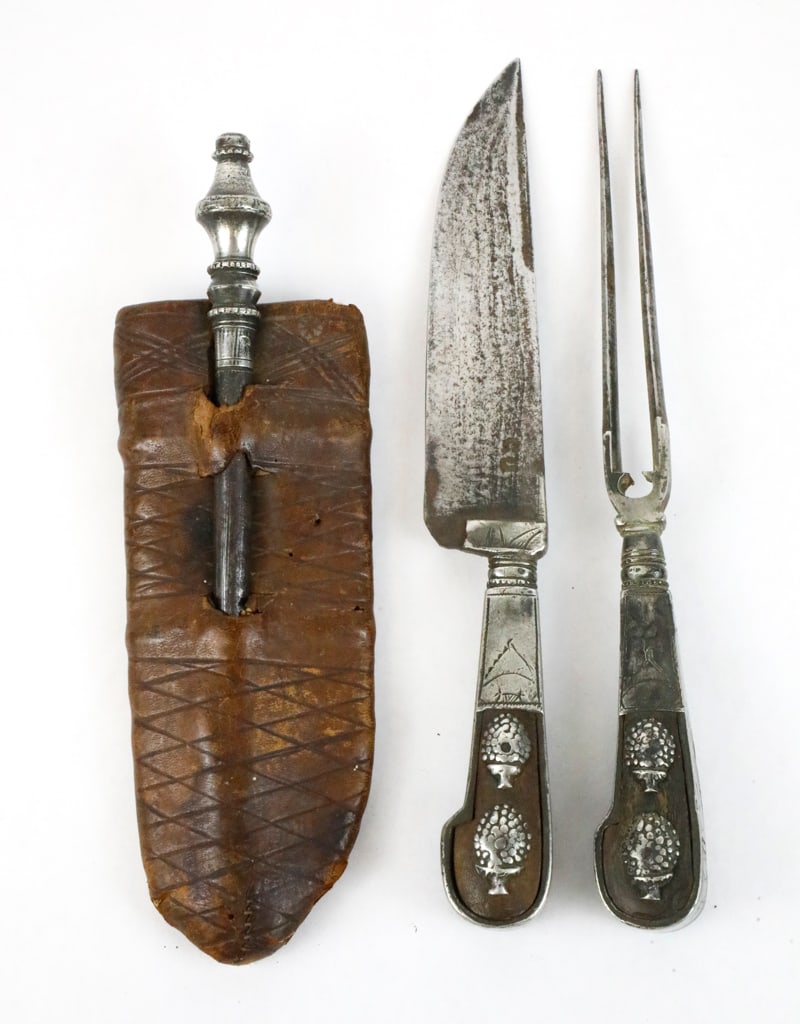 Three Piece Silverplate Carving Set: Three piece silverplate carving set with knife, fork, and sharpener, showing double tree design and engravings on the hollow wood handle. The set includes a leather sheath with geometric designs. Silv