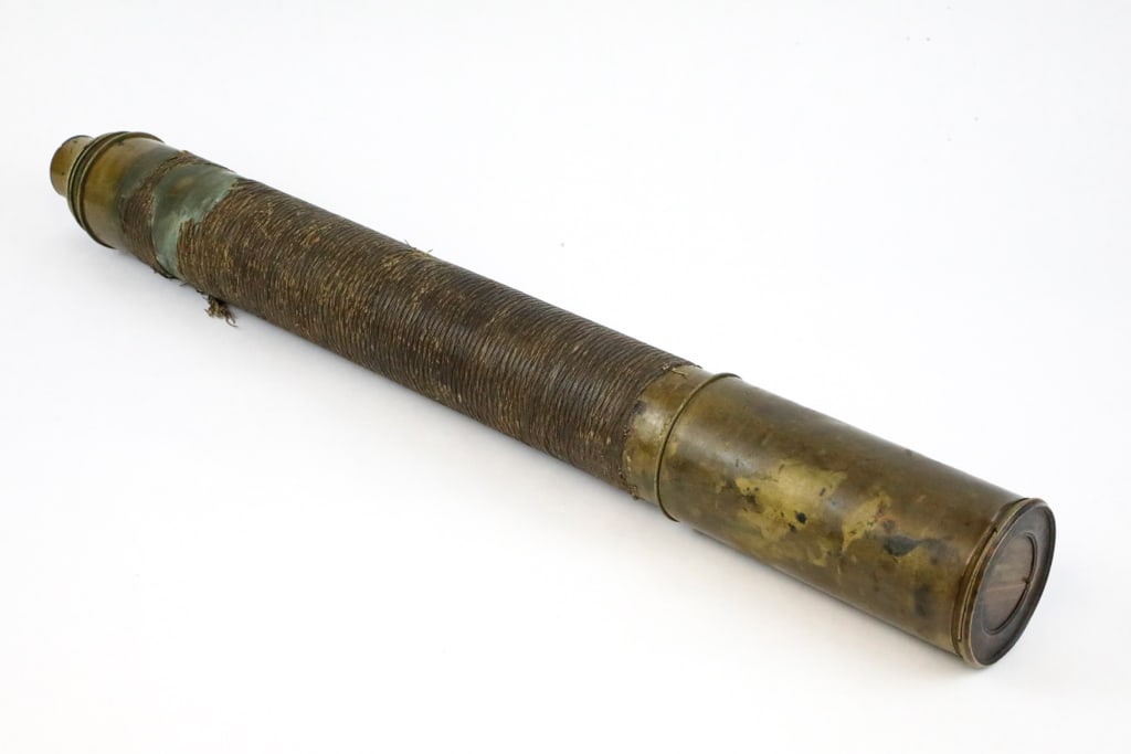 Circa 1800 Nautical Style Telescope: Circa 1800 English, nautical style telescope with captains draw. Features fancy rope work and brass hardware on the face of the telescope, and eye opening each with protective sliding shields. Split a