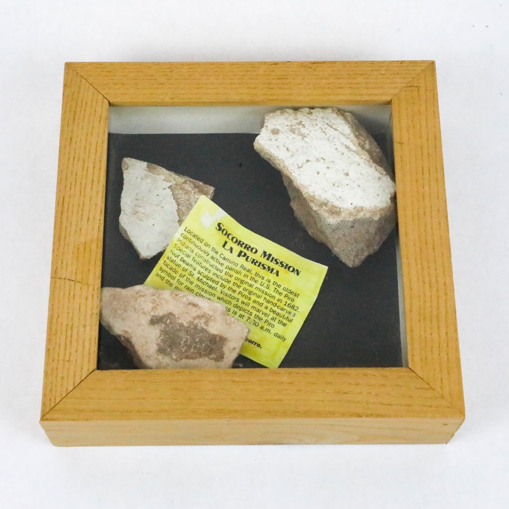Remnants of the Socorro Mission La Purisma: Remnants of the Socorro Mission La Purisma, original mission from 1682. The artifacts are presented in a clear topped, square wooden case with possibly an entrance ticket that states, "Located on the 