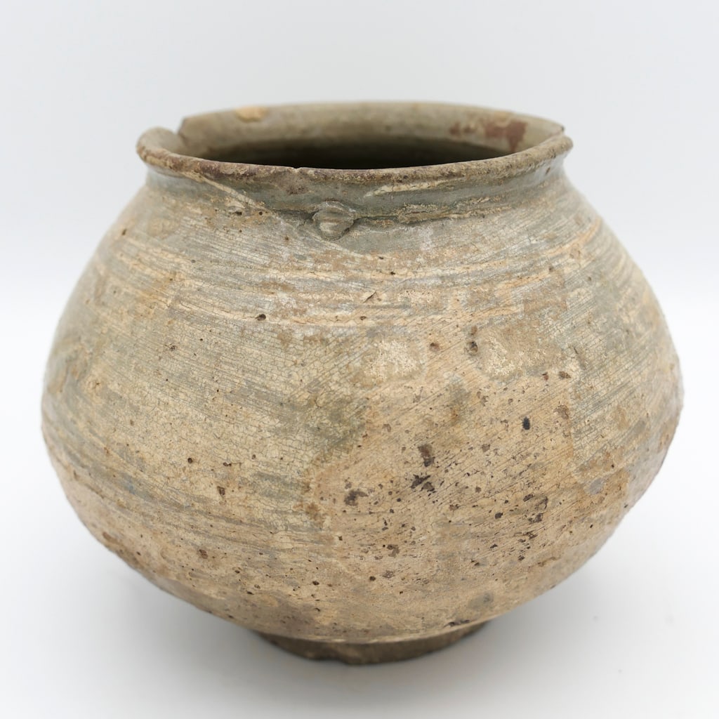 Bulbous Vase: Bulbous vase that is claimed to be from the second chinese dynasty. The vase shows a rough surface with horizontal marks. Size: 6.5"dia x 4.75"h