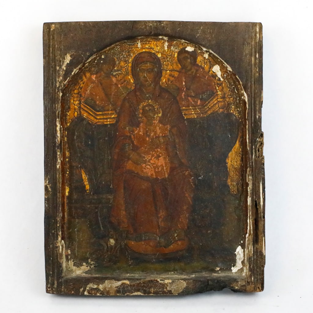 Antique Religious Wall Hanging: Antique religious wall hanging depicting the Madonna and child with two figures above. The wooden frame and paint texture show significant wear, cracking, and chips that is consistent with age. Believ