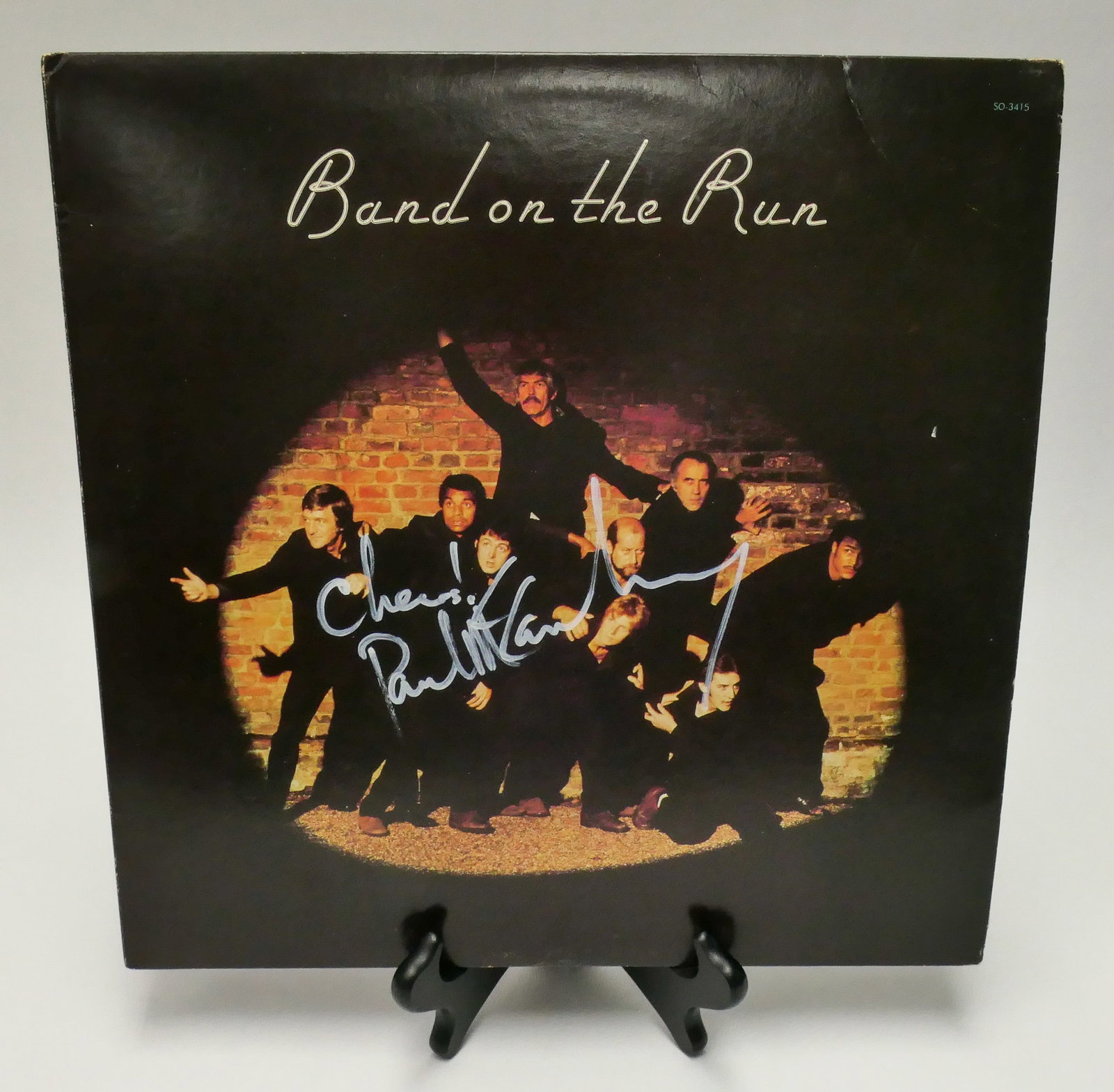 Signed Band on the Run Album: Signed copy of Paul McCartney, Band on the Run, containing the 33RPM vinyl record. Included in the sleeve is a certificate of authenticity from Live Kollectibles, listing Paul McCartney's signature. T
