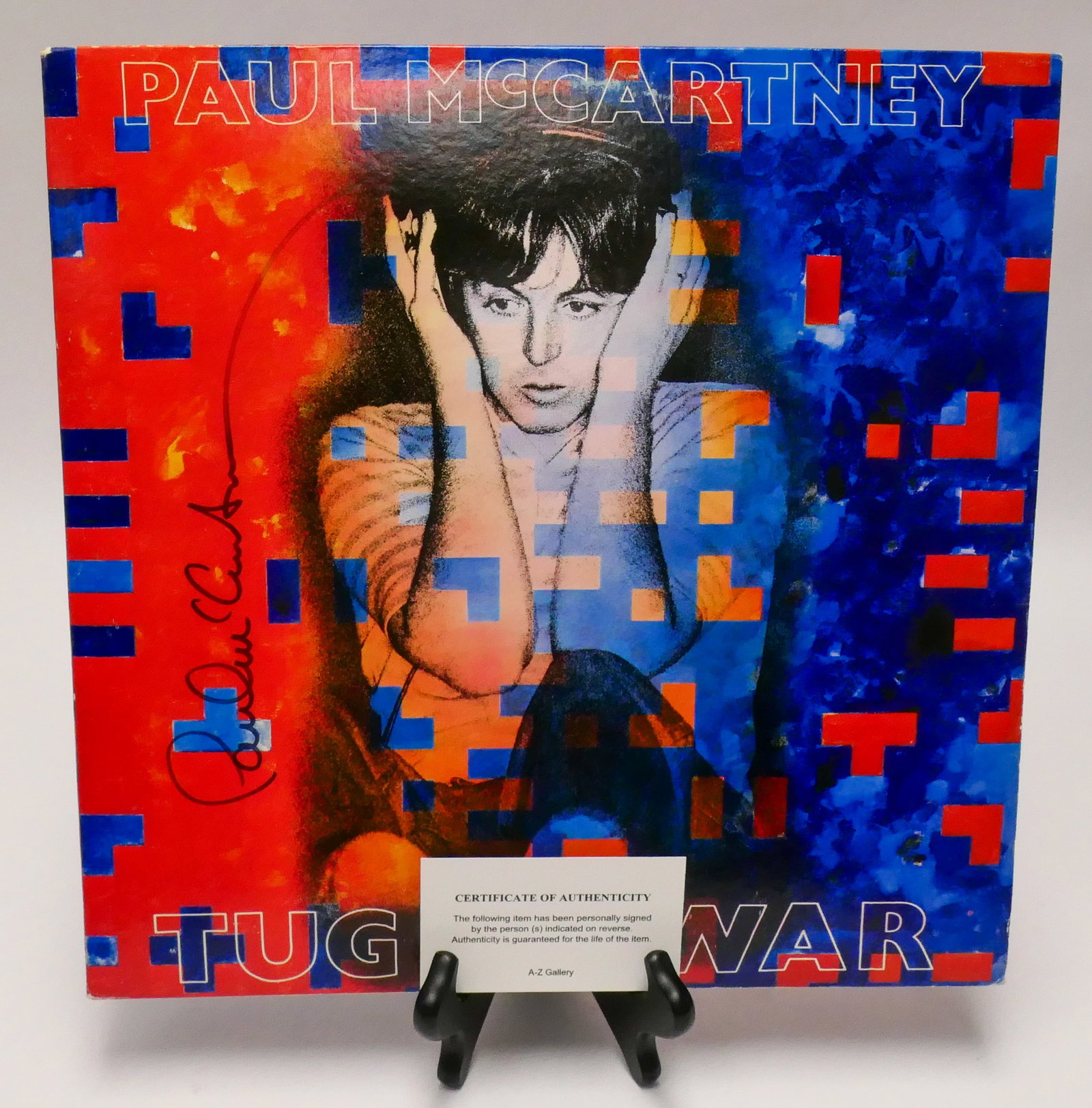 Signed Tug of War Album: Signed copy of Paul McCartney, Tug of War, containing the 33RPM vinyl record. Contained in the sleeve is a small certificate of authenticity from A-Z Galleries.