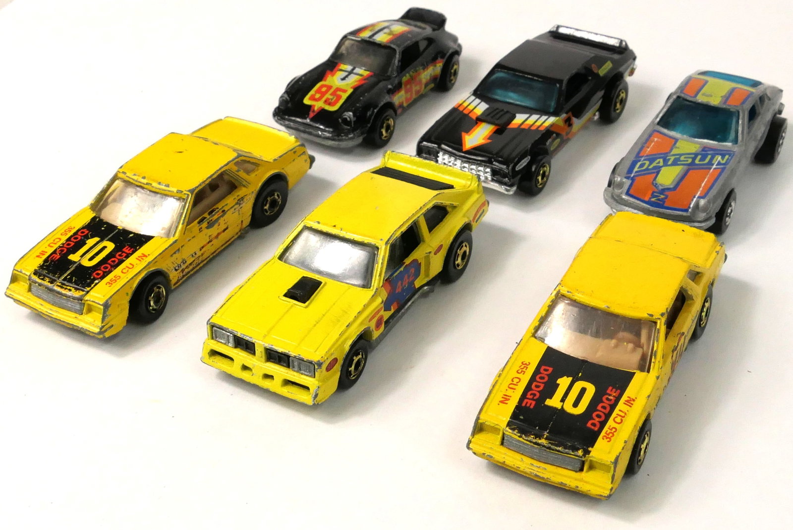 Six Vintage Hot Wheels Vehicles: Six vintage Hot Wheels vehicles including two 1980 Mirada Stockers, a 1976 Z Whiz, a 1978 Flat Out 442, a 1974 P-911, and more. All show some paint loss consistent with play. Size: Mirada Stocker 3.25