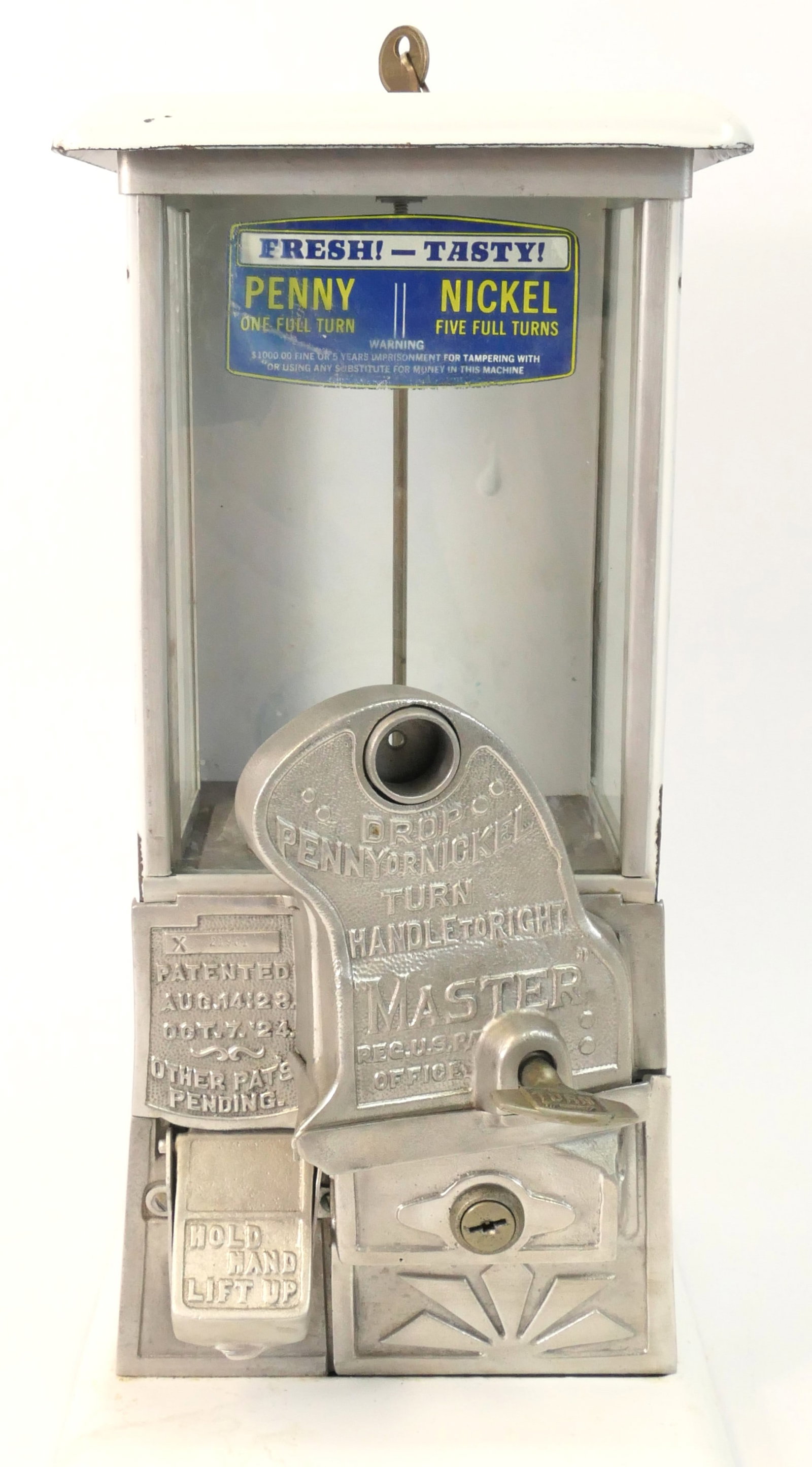 Countertop Gumball Machine: Countertop gumball or candy machine featuring a painted metal exterior and hardware that lists that it can accept pennies or nickels. The key for the upper lid is included, and functions like a screw.