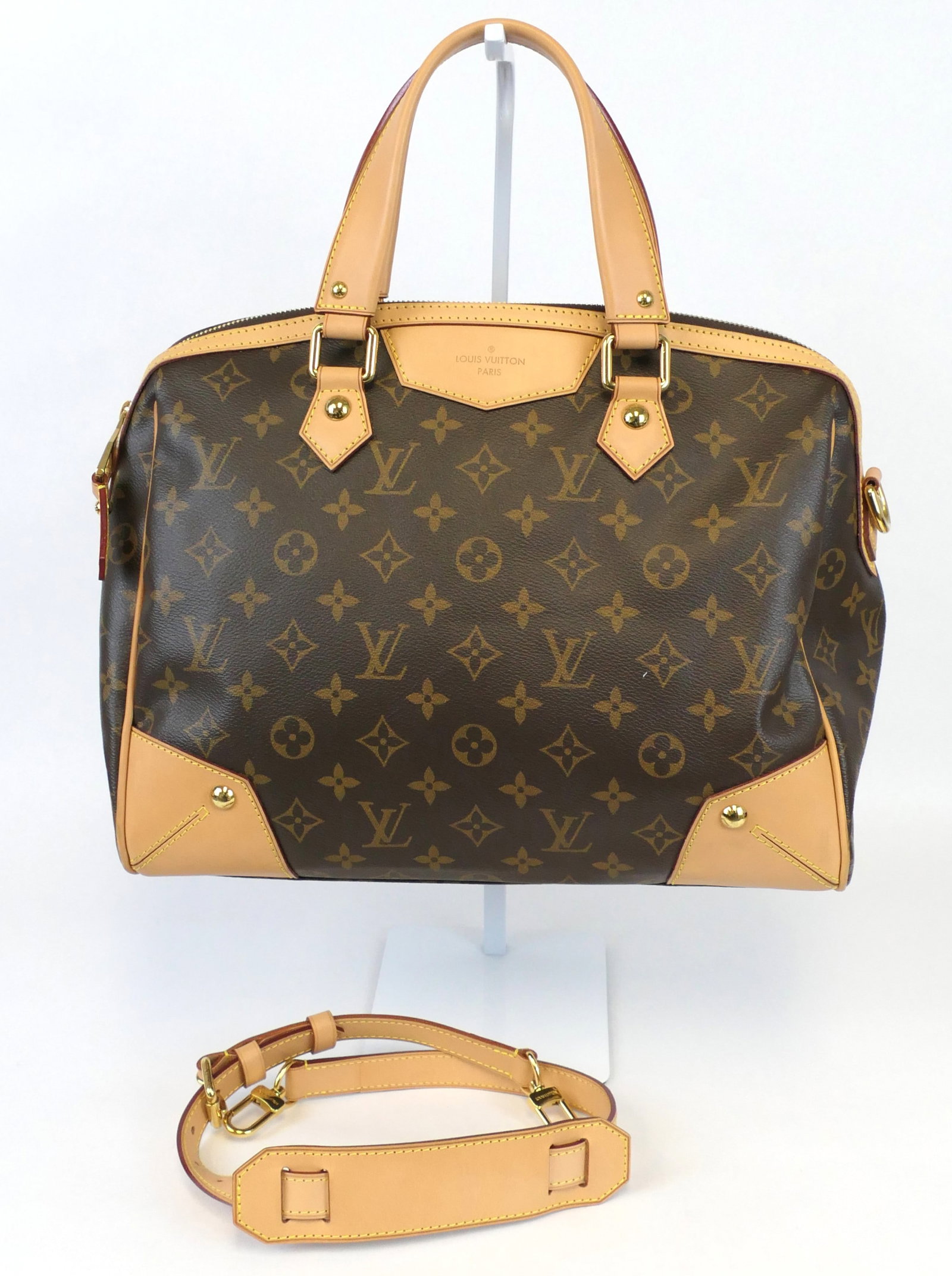 Louis Vuitton Retiro PM Shoulder Bag in Monogram Canvas: Louis Vuitton Retiro PM shoulder bag in classic monogram canvas with vachetta leather trim, gold tone hardware and sand interior, 2012. Serial # AR4142. Excellent condition. Size: 13"w x 7"d x 10"h