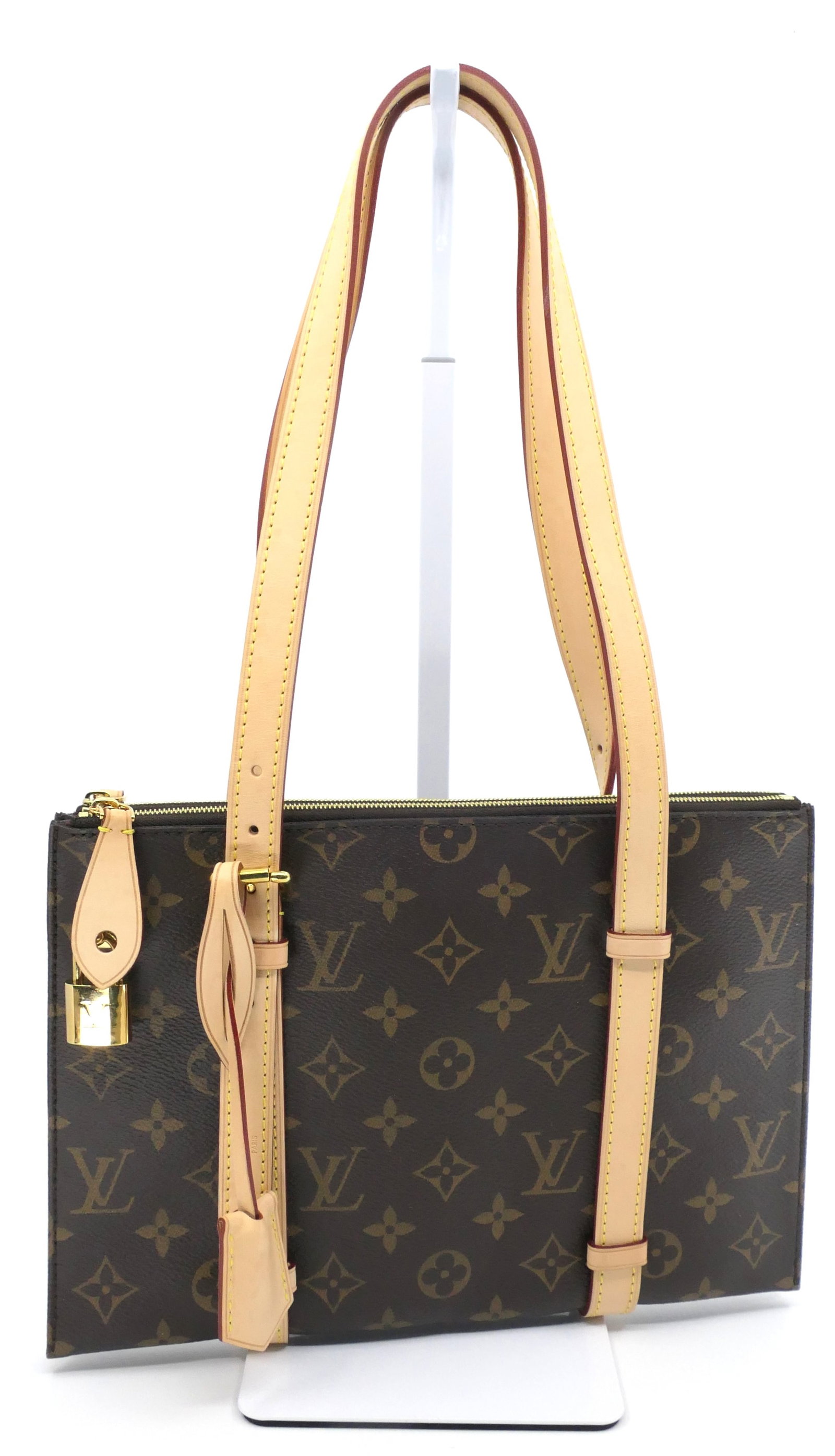 Louis Vuitton Carrousel Tote in Monogram Canvas: Louis Vuitton Carrousel tote in classic monogram canvas with vachetta leather trim, gold tone hardware and fabric interior, 2014. Serial # AA2114. Excellent condition. Size: 11"w x 7.5"h