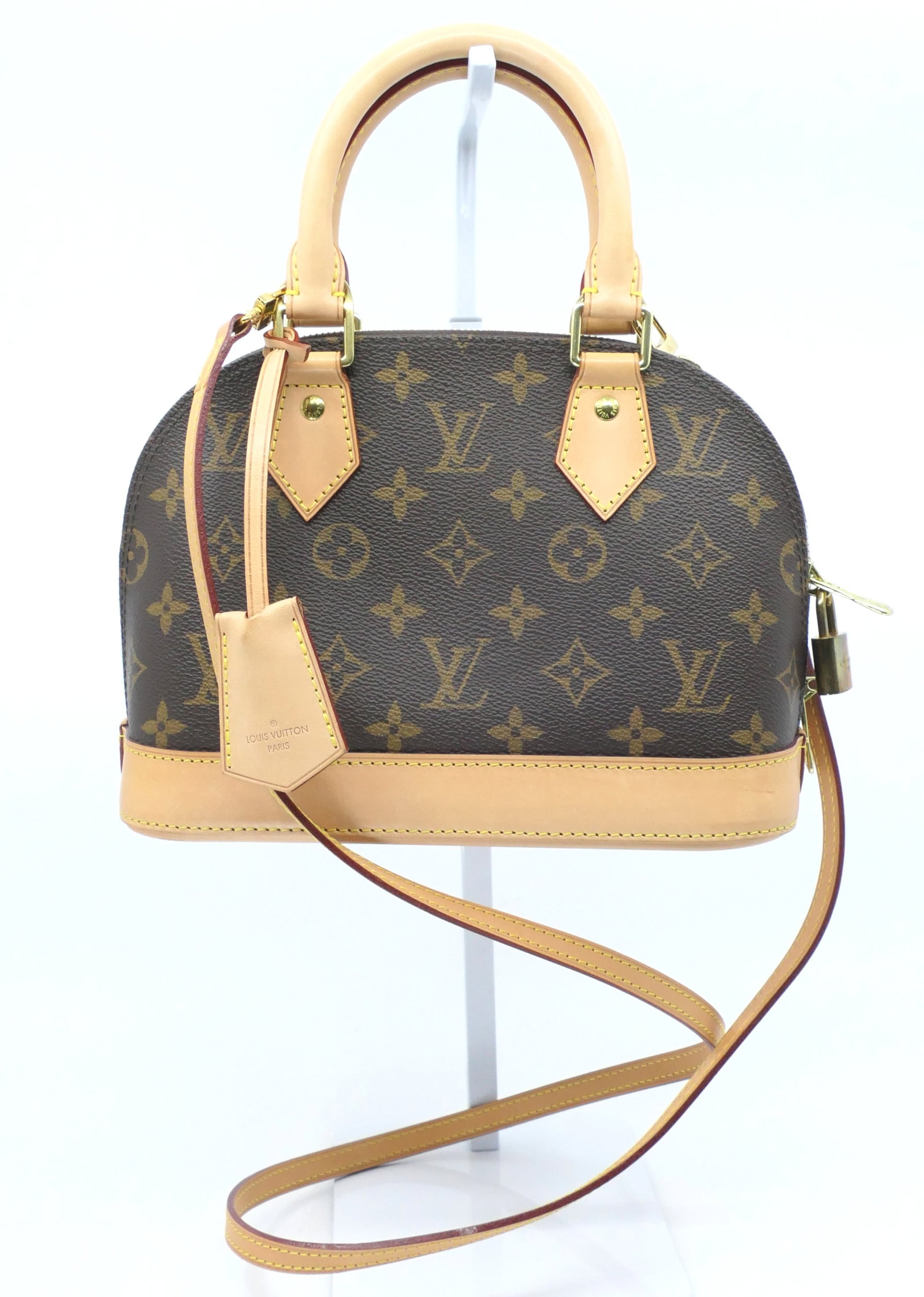 Louis Vuitton Alma BB Crossbody in Monogram Canvas: Louis Vuitton Alma BB crossbody in classic monogram canvas with vachetta leather trim, gold tone hardware and fabric interior, 2010. Serial # FL2110. Very good condition. Size: 9"w x 4.5"d x 6.5"h