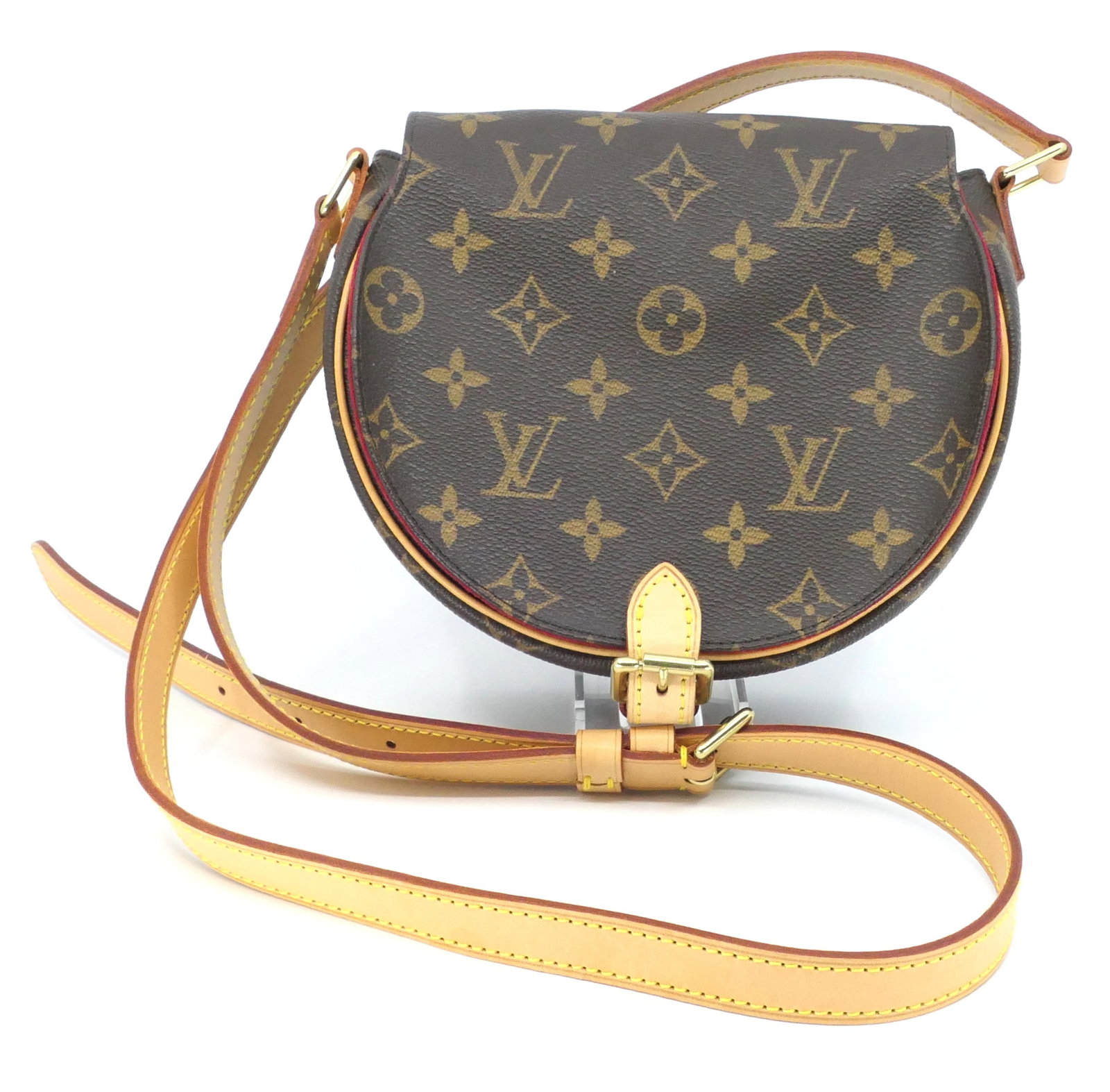 Louis Vuitton Tambourin Monogram Canvas Bag: Louis Vuitton Tambourin shoulder bag in classic monogram canvas with vachetta leather trim, gold tone hardware and red interior, 2005. Serial #`FL0035. Excellent condition. Size: 7.5"w x 3"d x 6.5"h