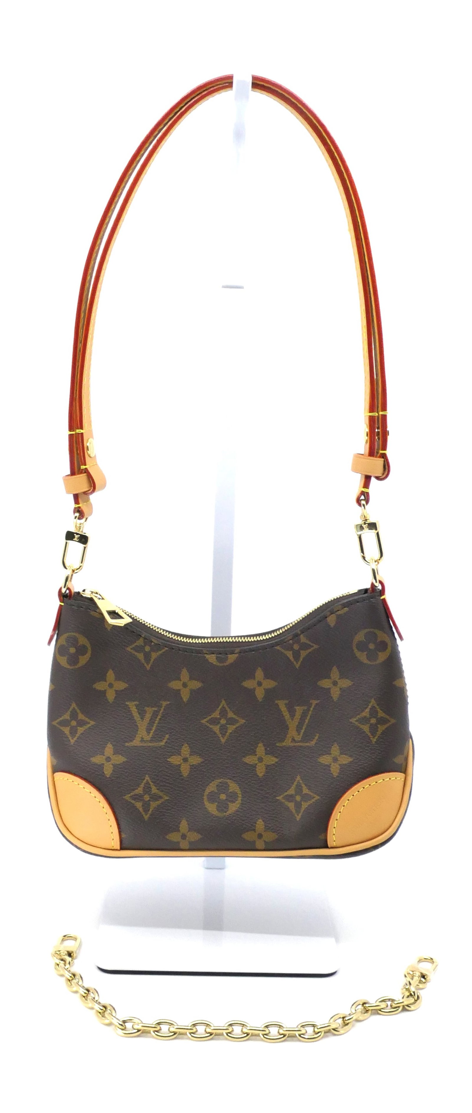 Louis Vuitton Nano Boulogne Monogram Canvas Bag: Louis Vuitton Nano Boulogne bag in classic monogram canvas with vachetta leather trim, gold tone hardware and fabric interior with leather and chain strap. Excellent condition. Size: 8"w x 2.5"d x 5"h