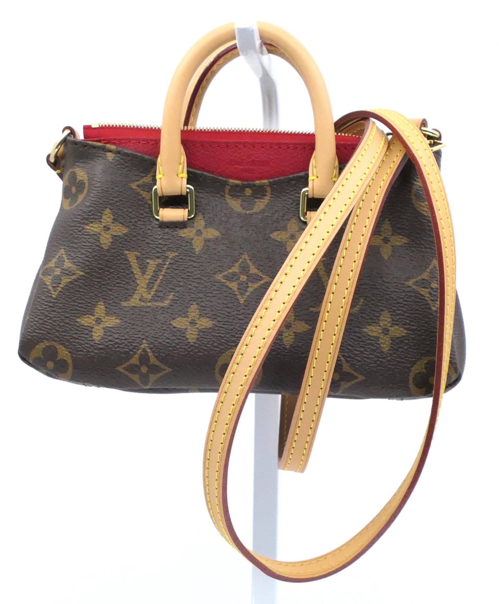Louis Vuitton Nano Crossbody in Red Monogram Canvas: Louis Vuitton Nano Pallas crossbody in red and classic monogram canvas with vachetta leather trim, gold tone hardware and dark interior, 2015. Serial # SN2155. Excellent condition.
