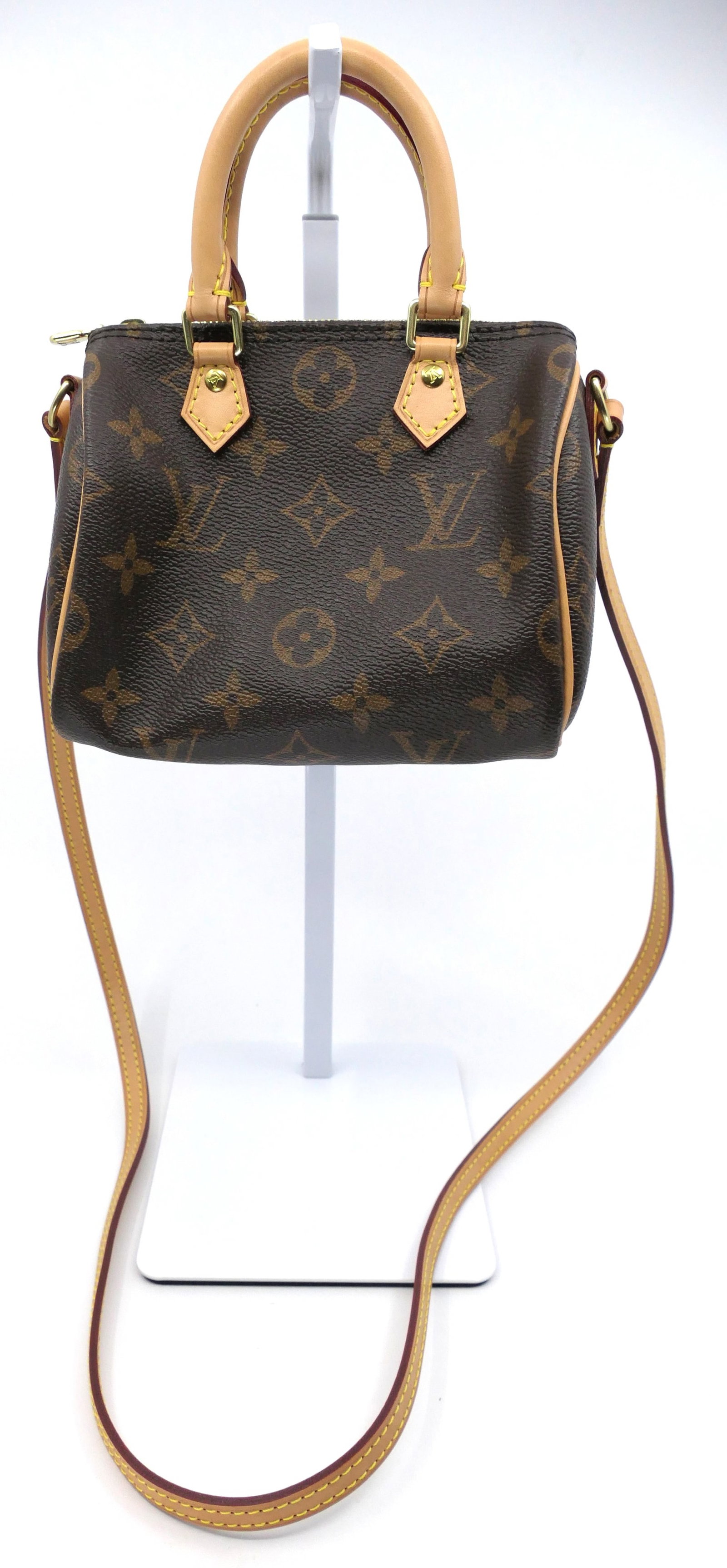 Louis Vuitton Nano Speedy Monogram Canvas Bag: Louis Vuitton Nano Speedy crossbody in classic monogram canvas with vachetta leather trim, gold tone hardware and non detachable straps, 2015. Serial # TR2115. Excellent condition. Size: 6"w x 3.5"d x