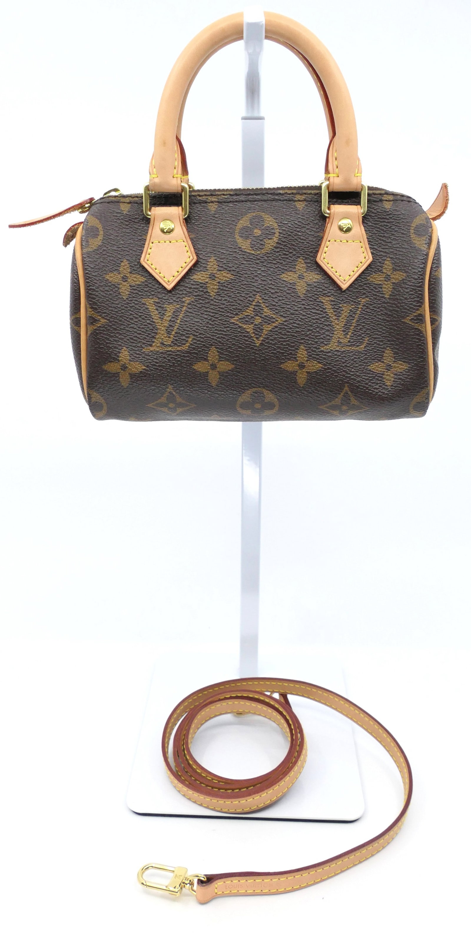 Louis Vuitton Mini Nano Speedy Monogram Canvas Bag: Louis Vuitton mini Nano Speedy in classic monogram canvas with vachetta leather trim, gold tone hardware and detachable shoulder strap. Serial # TR2161. Excellent condition. Size: 6.5"w x 3"d x 4"h