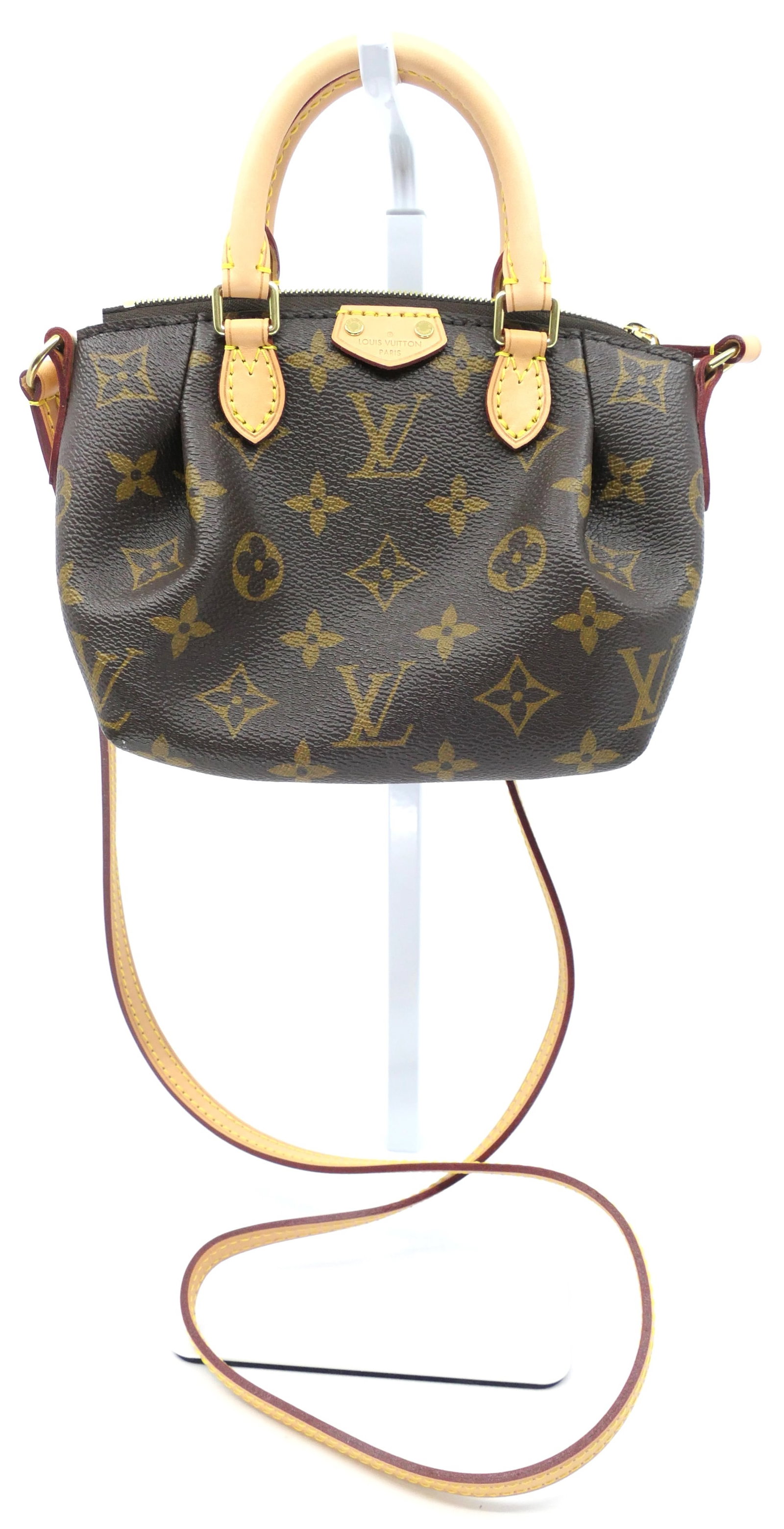 Louis Vuitton Nano Turenne Monogram Canvas Bag: Louis Vuitton Nano Turenne crossbody in classic monogram canvas with vachetta leather trim, gold tone hardware and fabric interior. Serial # SR1195. Excellent condition. Size: 7"w x 3"d x 5"h