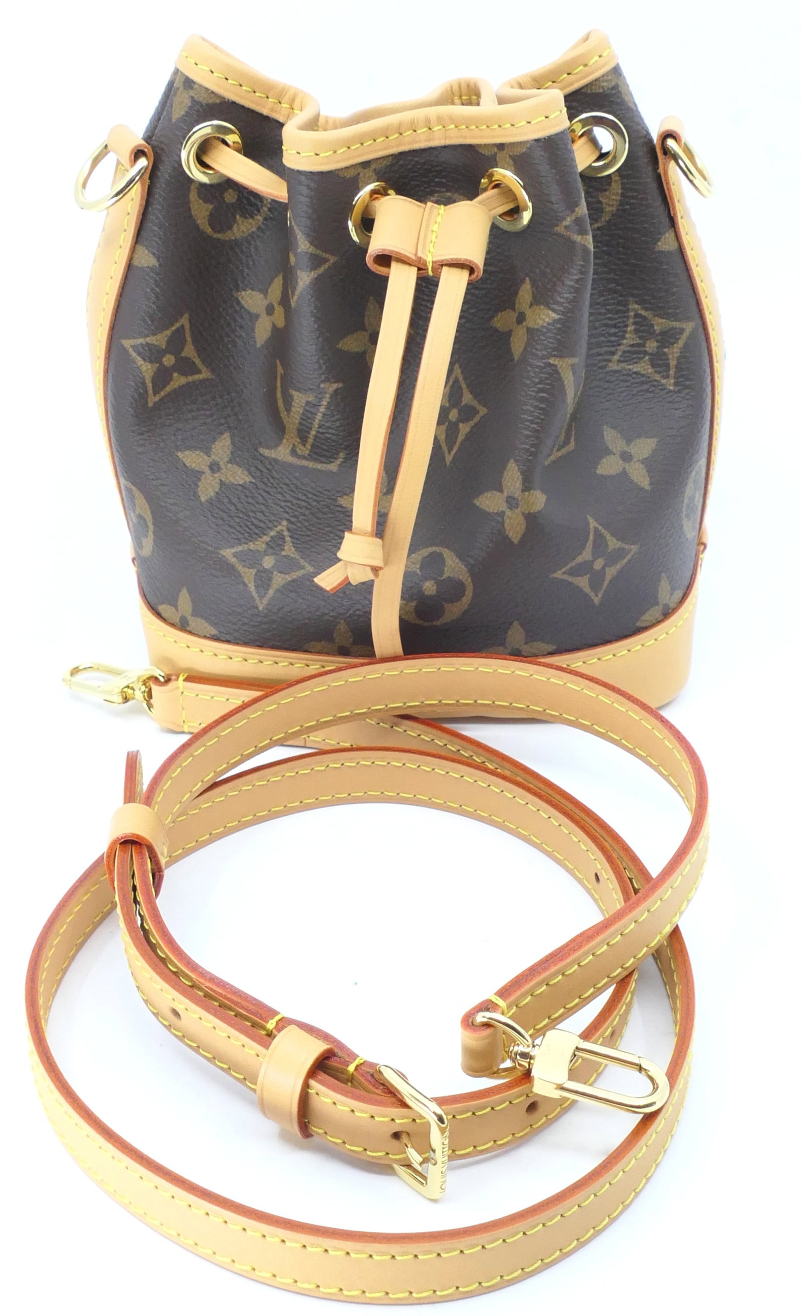 Louis Vuitton Nano Noe Monogram Canvas Bag: Louis Vuitton Nano Noe crossbody in classic monogram canvas with two straps, vachetta leather trim, gold tone hardware and fabric interior. Excellent condition, appears new. Size: 5.5"w x 4"d x 6"h