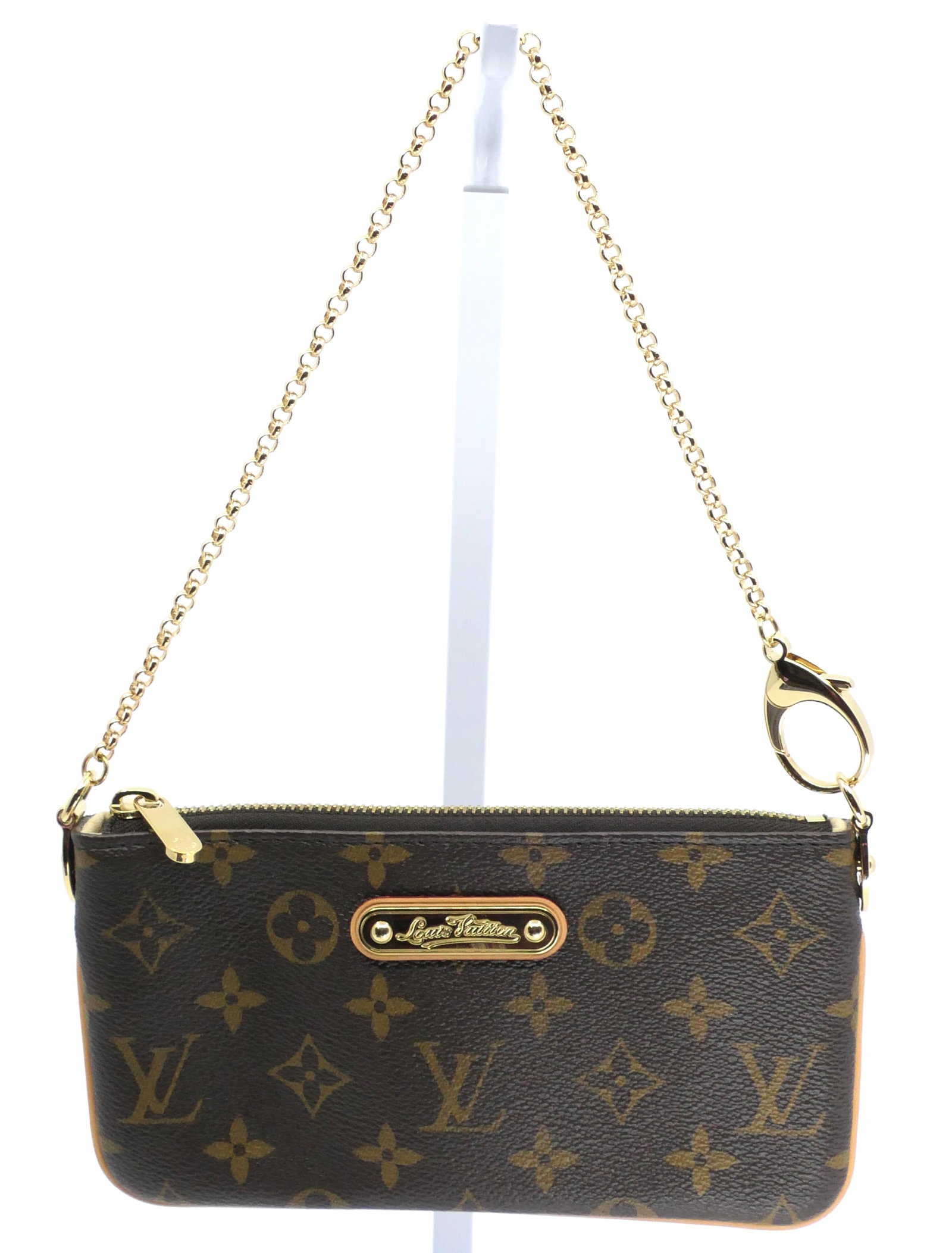 Louis Vuitton Milla Pochette Monogram Canvas Bag: Louis Vuitton Milla Pochette in classic monogram canvas with vachetta leather trim, gold tone hardware and light interior, 2008. Serial # VI2048. Excellent condition. Size: 7.75"w x 4.25"h