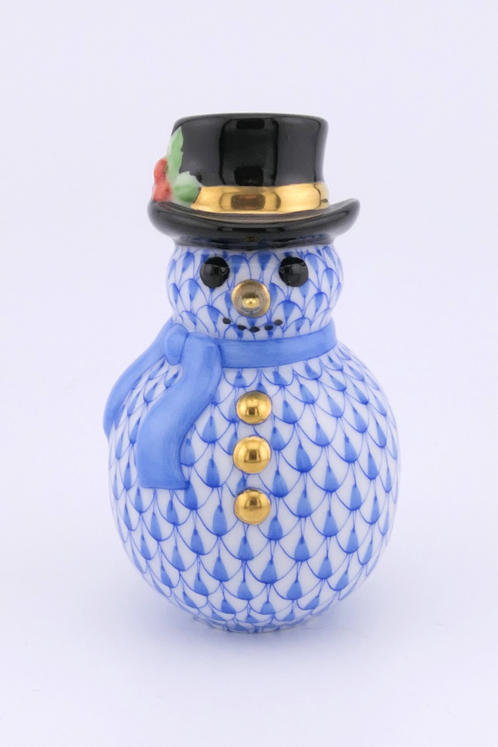 Herend Snowman Figurine: Marked Herend porcelain figurine featuring a snowman design in blue fishnet patterning. Marked on the bottom with the Herend insignia. Excellent condition. Size: 1.75"dia x 3"h Location: Living Room
