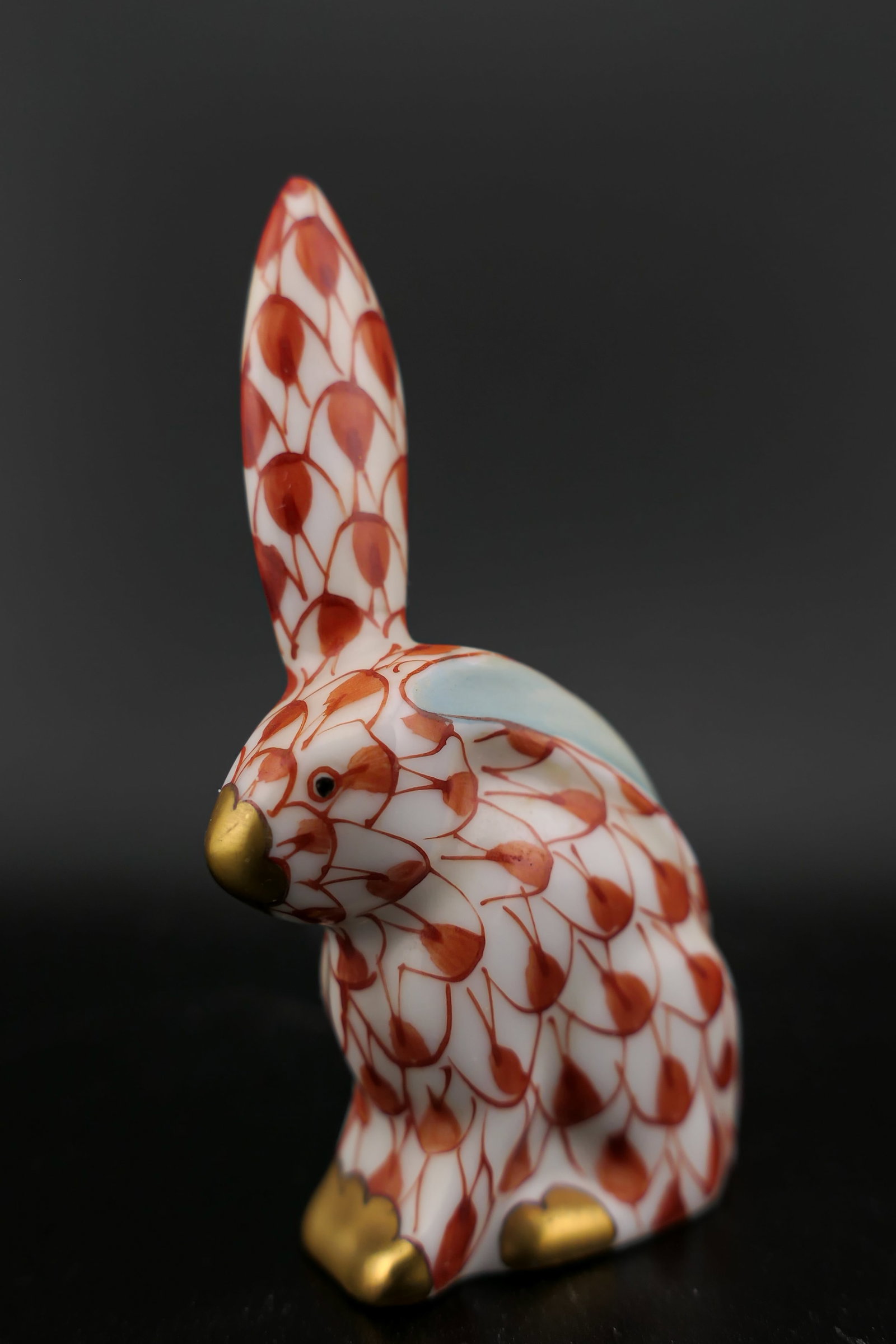 Herend Rabbit Figurine: Marked Herend porcelain figurine featuring a rabbit design in rust fishnet patterning. Marked on the bottom with the Herend insignia. Excellent condition. Size: 2"h Location: Living Room