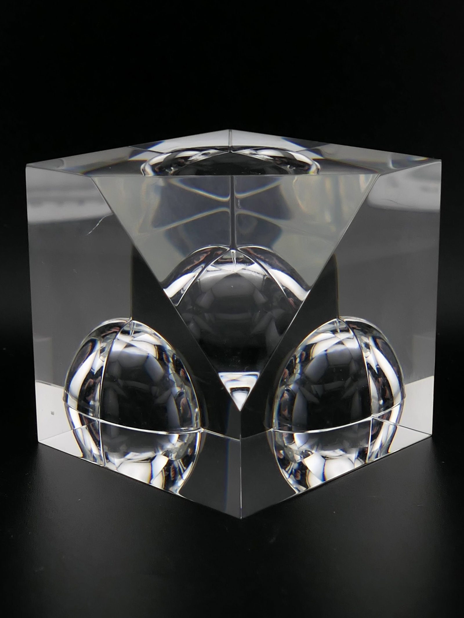Steuben Crystal Floating Sphere Paperweight: Marked Steuben crystal paperweight featuring a cubic design titled Floating Sphere. Etched along the bottom Steuben. Very good condition with a scratch on one side. Size: 2" cube Location: Living Room