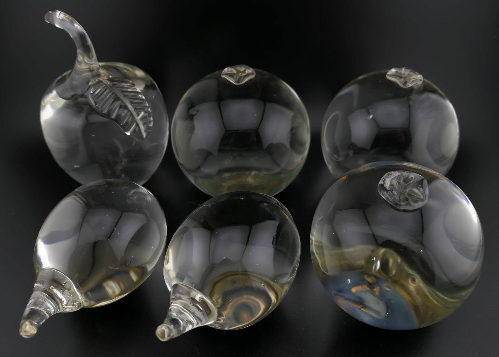 Kerry Zimmerman Crystal Fruits: Kerry Zimmerman crystal accent fruit paperweights including apples, lemons, and pomegranates. Signed on the bottom Kay Zimmerman 2007. Excellent condition. Size: Largest 3"dia Location: Living Room