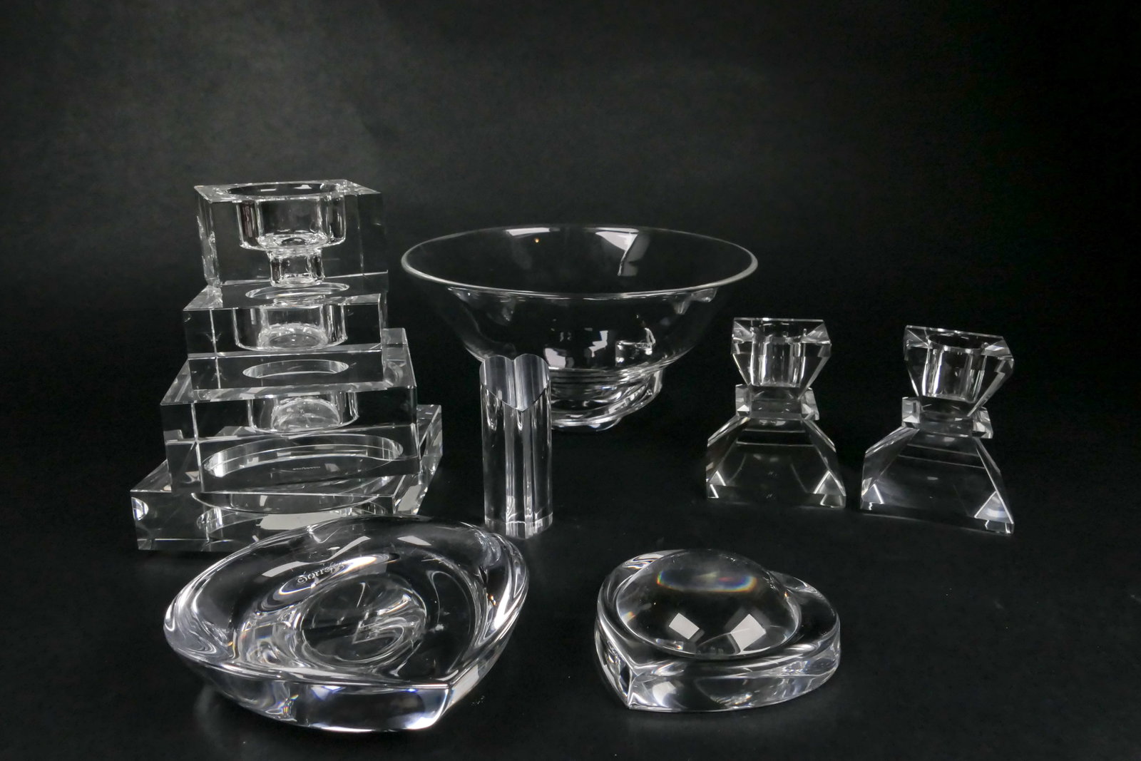 Assortment of Crystal Accent Pieces: Crystal accent pieces including a Steuben Snake Spiral bowl designed by Donald Pollard, an Orrefors Crystal Totem Majestic stacking candle holder set, two Hoya Crystal hearts including a magnifying le