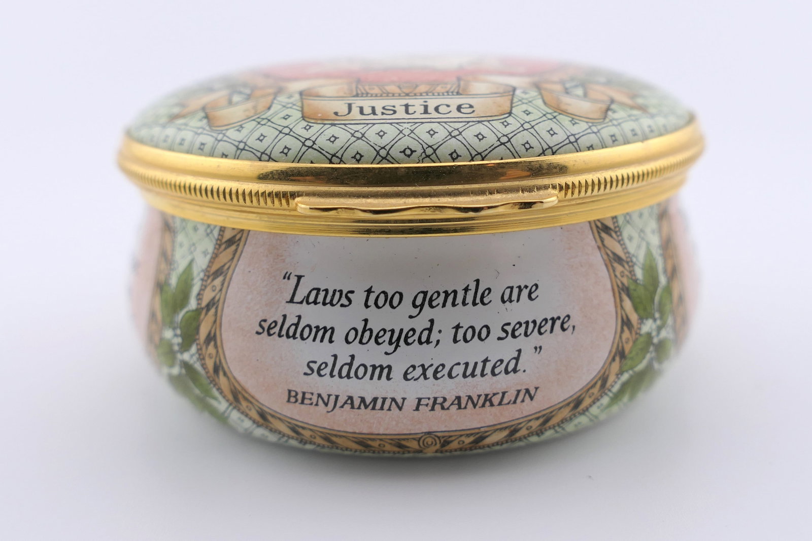 Halcyon Days Justice Trinket Box: Marked Halcyon Days hinged trinket box featuring a Justice motif with quotes from notable historical figures. Marked on the bottom Halcyon Days Enamels. Excellent condition. Size: 2.5"dia x 1.25"h Loc