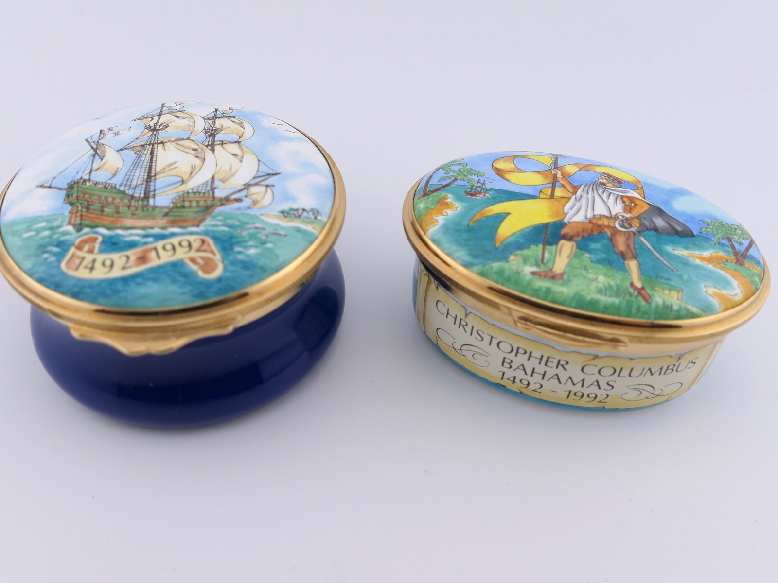 Two Christopher Columbus Trinket Boxes: Two porcelain trinket boxes by Toye, Kenning, & Spencer in Christopher Columbus patterns commemorating the 500 year anniversary of the 1492 journey. Both are marked on the bottom and limited edition 9