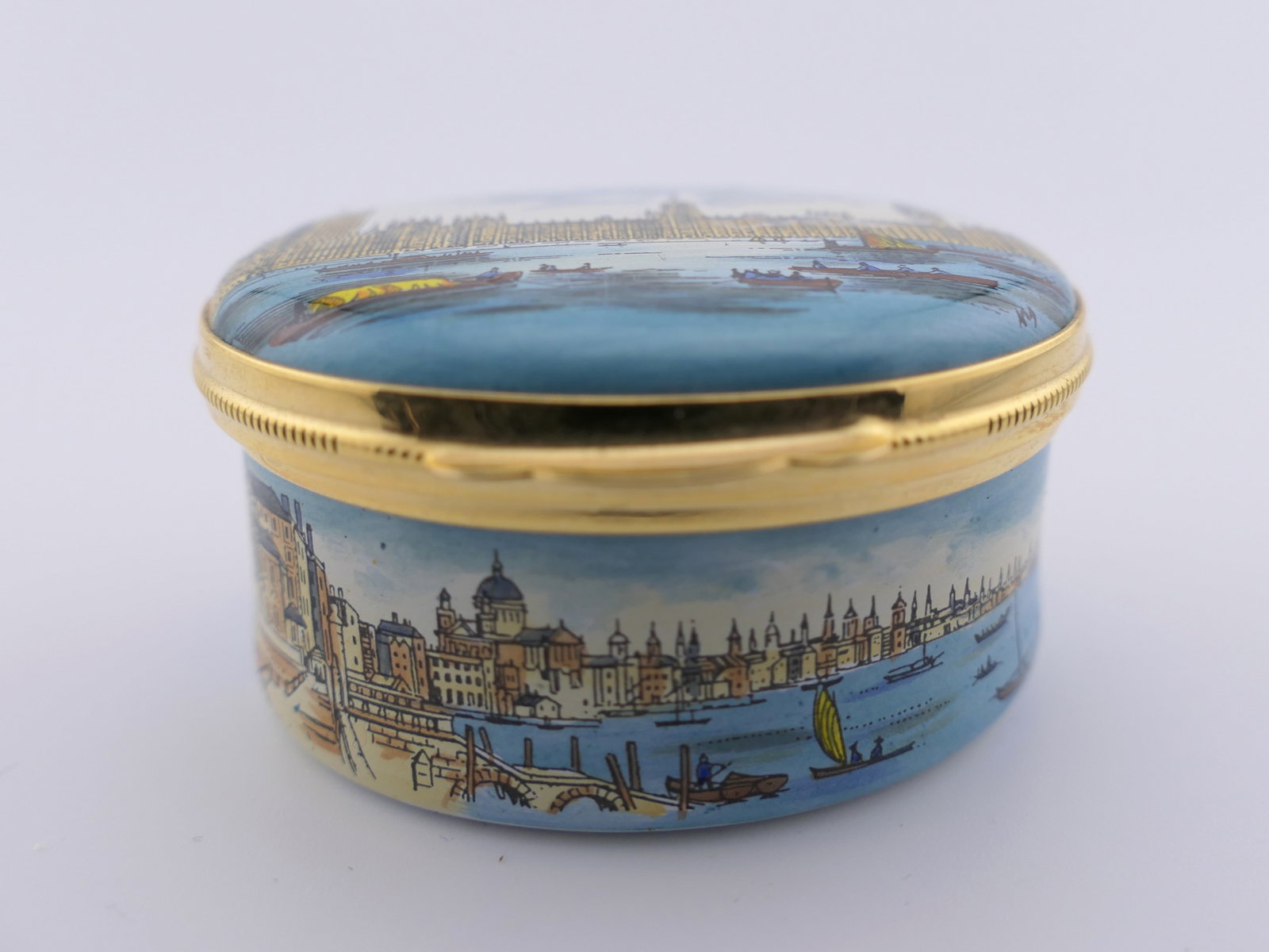 Crummels and Co Westminster Palace Trinket Box: Marked Crummels & Co. trinket box titled "The Palace of Westminster", with a landscape motif on the lid and sides. Marked on the bottom, Hand Painted in Fine Enamel, Made in England by Crummels & Co. 