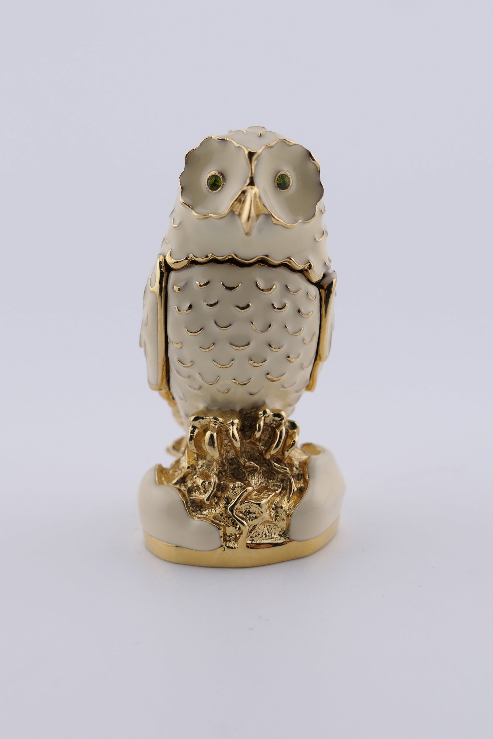 Estee Lauder Glistening Owl Solid Perfume Compact: Estee Lauder solid perfume compact in the shape of an owl titled "Glistening Owl" (2005) in cast metal and enameled, with green rhinestone eyes. Very good condition, with the perfume showing slight