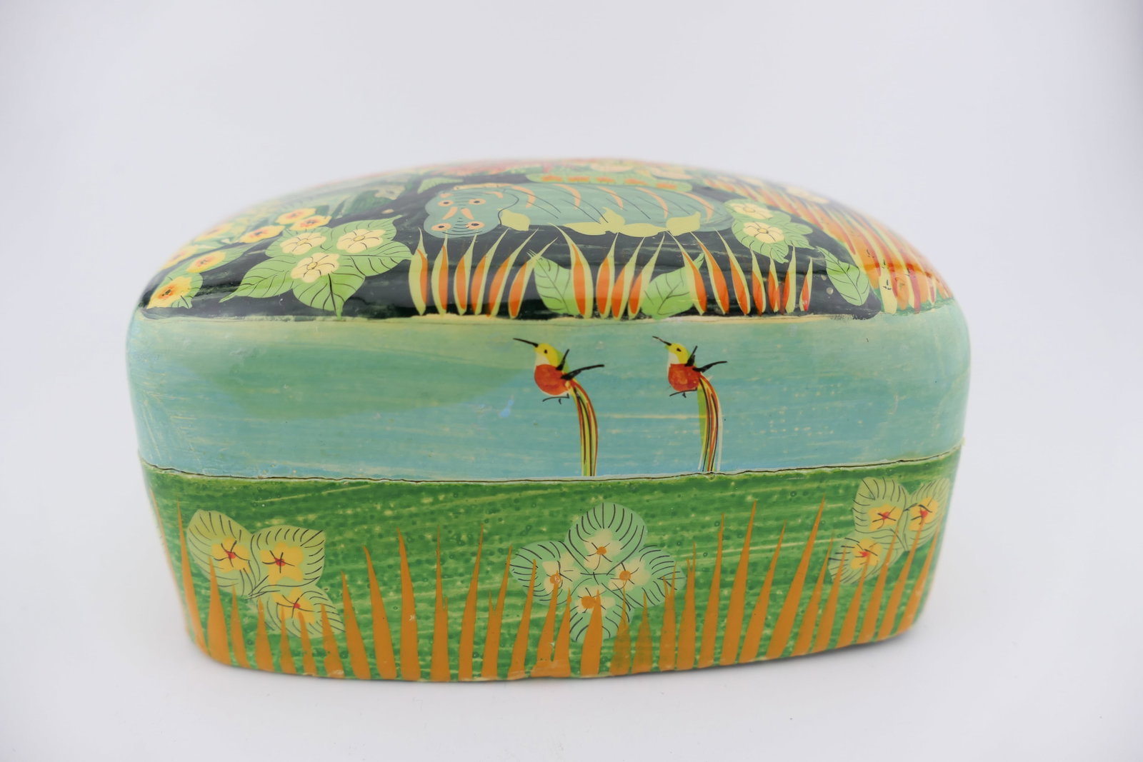 Hand Painted Indian Trinket Box: Hand painted Indian made trinket box featuring a lacquered finish over a colorful jungle scene. Very good condition with minor paint chipping. Size: 4.75"w x 3.5"d x 2.25"h Location: Living Room