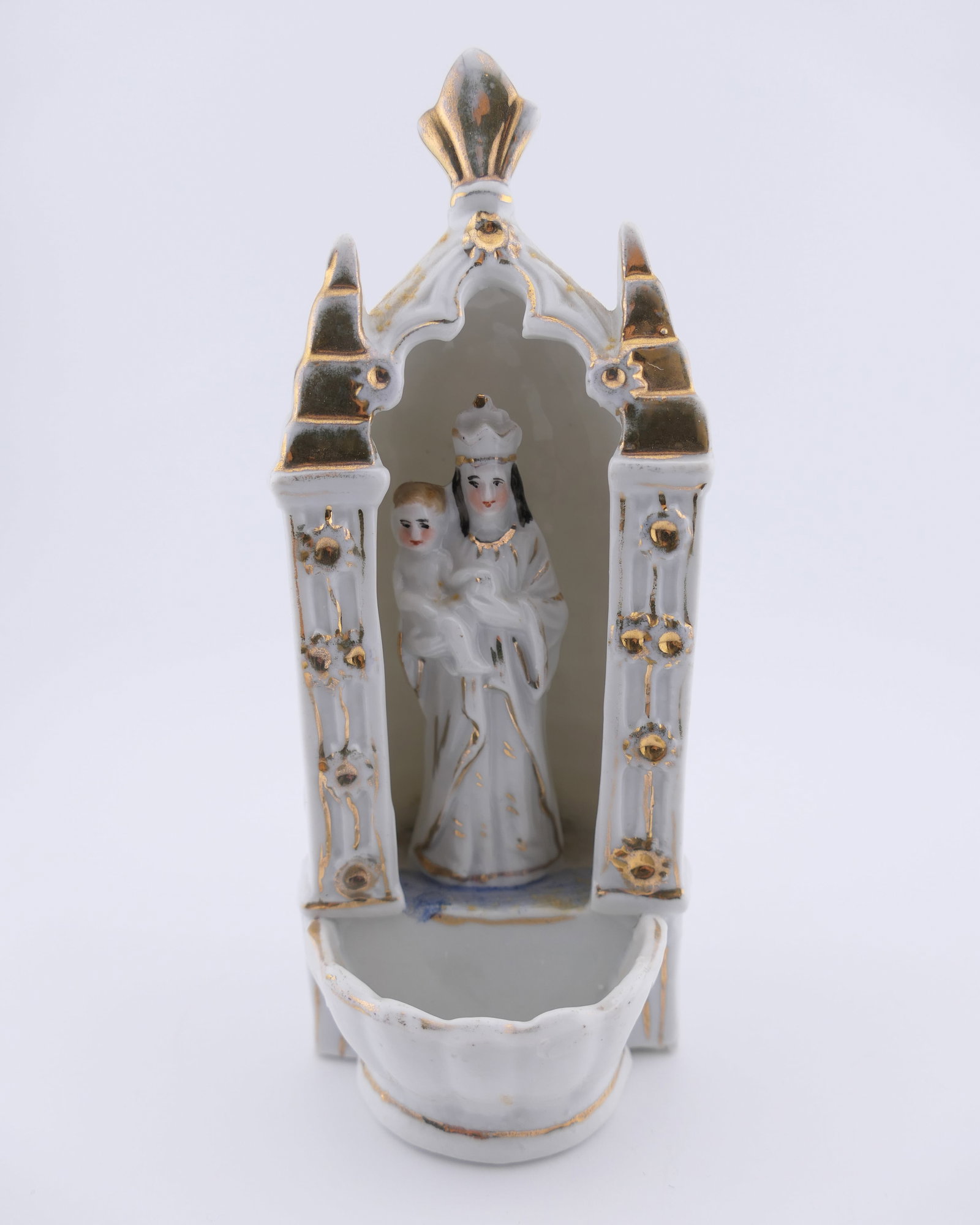 Antique Porcelain Holy Water Font: Antique porcelain holy water font featuring a figural Madonna and Child motif in the center of gilt accented pillars and arch. Very good condition, with minor loss of gold tone coloration. Size: