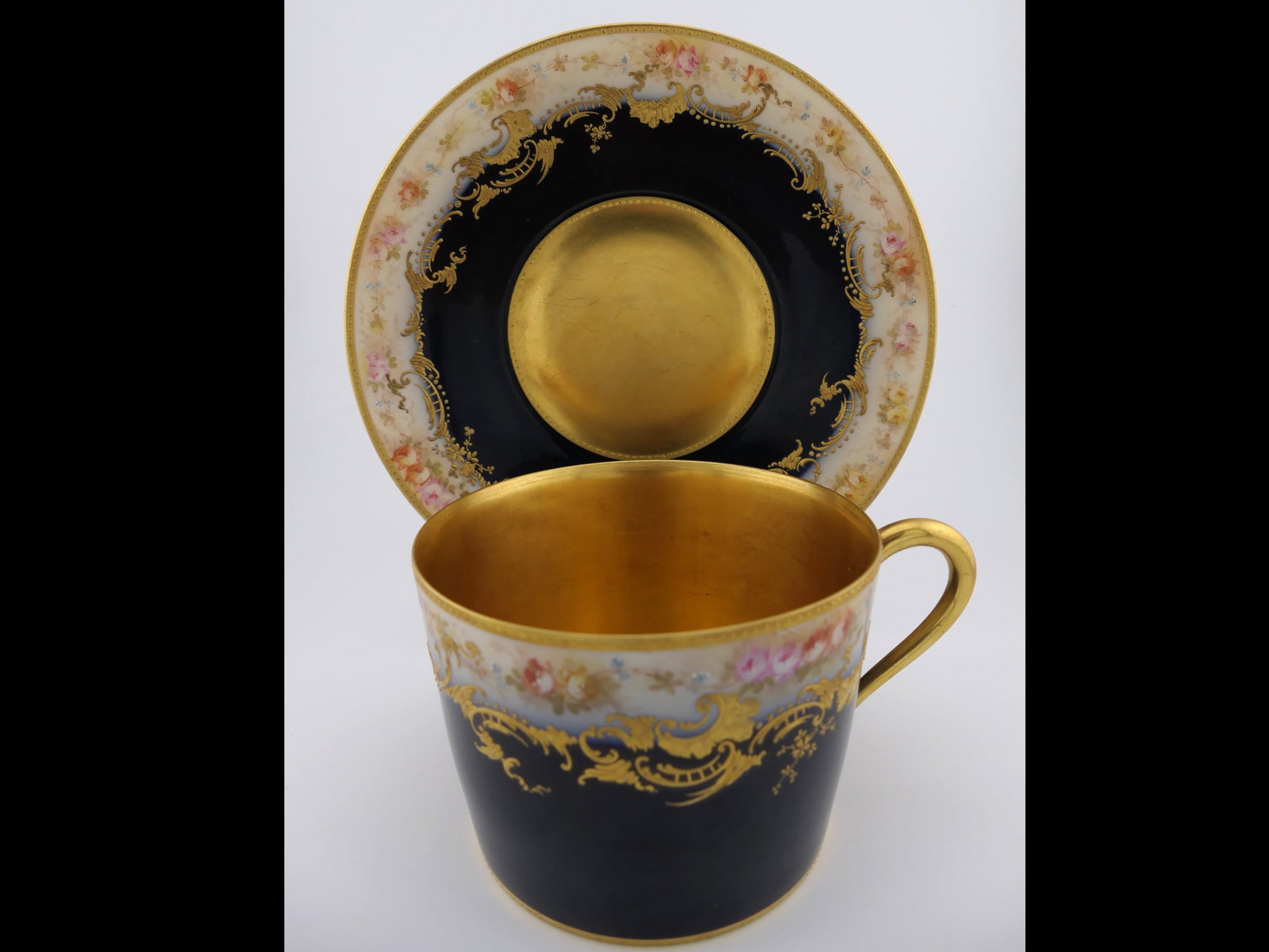 Antique Haviland Limoges Chocolate Cup: Antique circa 1900 oversized tea or chocolate cup by Haviland Limoges, believed to be a custom creation with matching saucer, and monogrammed with an 'N' which is unusual for a cup of this size. The
