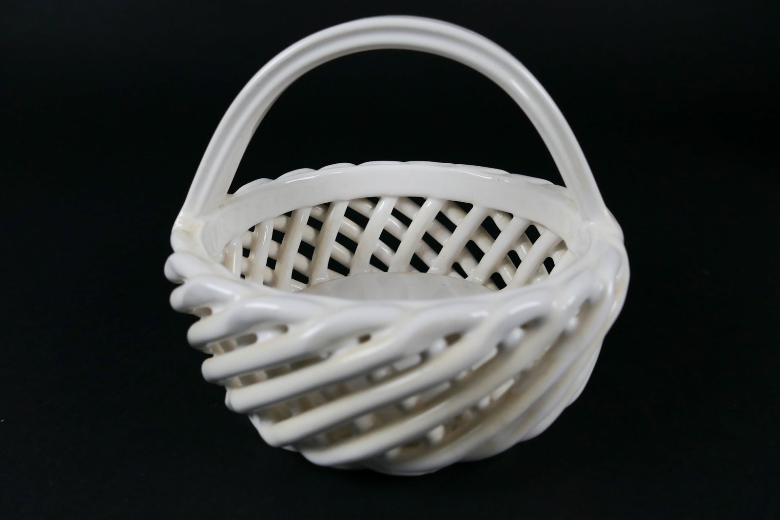 Three Ceramic Baskets: Three ceramic baskets including Eucalyptus Stoneware, basket with handle and reticulated bowl with gilt accents. Excellent condition. Size: Largest 9"w x 7"d x 3.5"h Location: Living Room