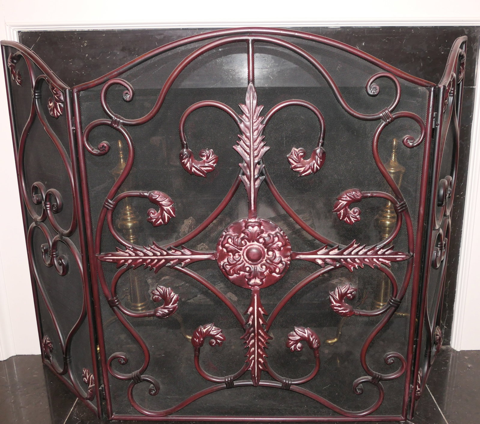 Fireplace Accessories: Fireplace accessories including 3 panel fireplace screen with medallion motif and pair of brass andirons with eagle finials. Size: Screen 4'w x 35.5"h Location: Living Room