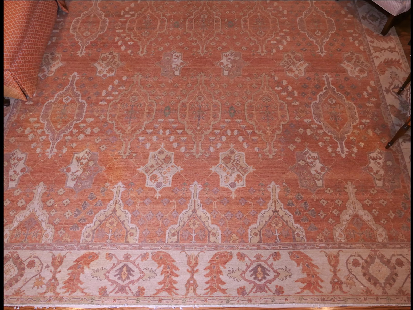 Michaellan Kohlberg Oushak Area Rug: Large oriental area rug by Michaellan Kohlberg, sold by Anabel's Oriental Rugs in Louisville, Kentucky, hand-knotted, vegetable dyed, and hand-spun in an overall salmon coloration with a beige border,