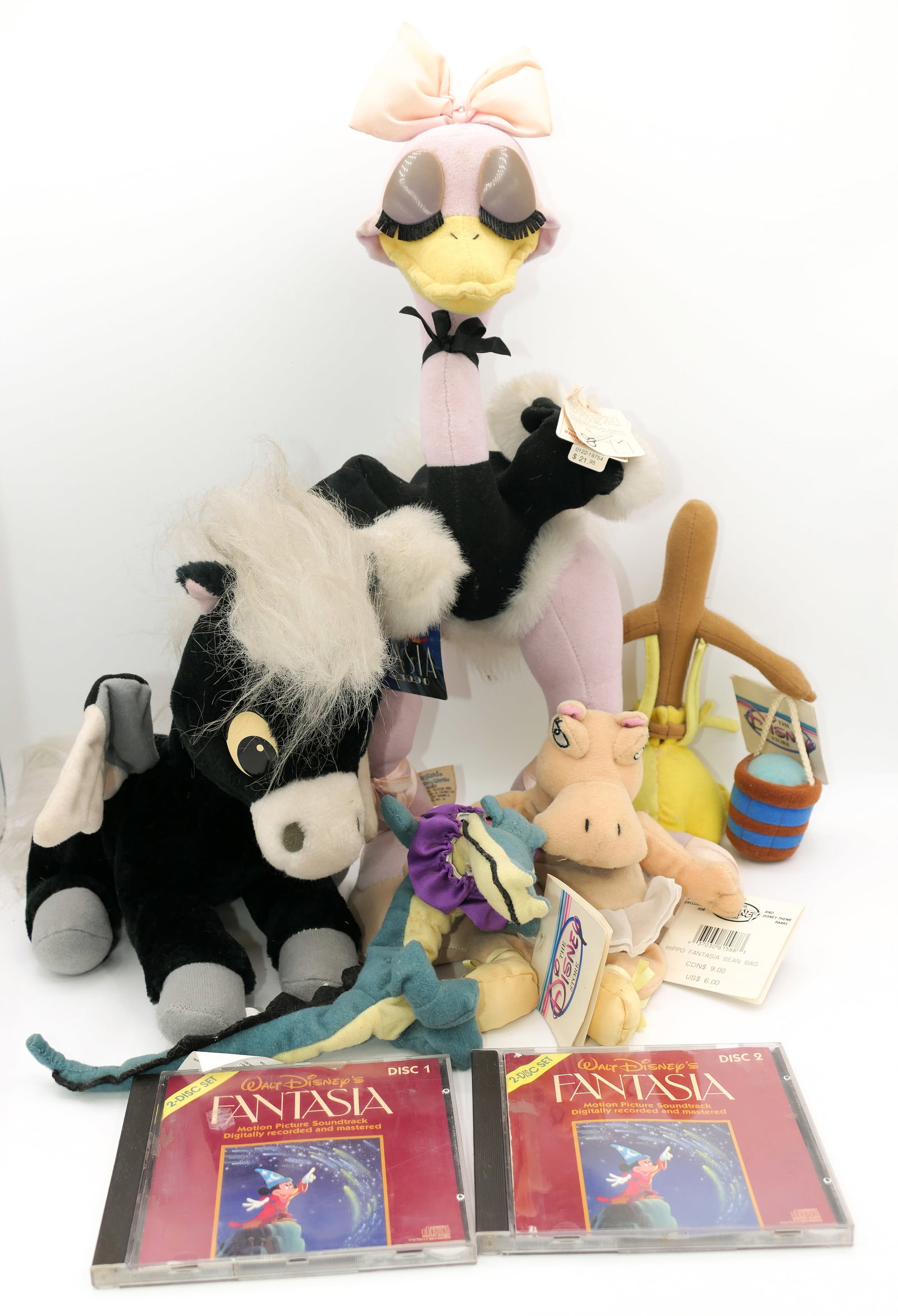 Disney Fantasia Plush Toys and CD's: Disney Fantasia plush toys which includes Mademoiselle Upanova, Pegasus, Sorcerer Broom, Hippo bean bag and Alligator bean bag. Also includes 2 disc set of Fantasia soundtrack CD's. Some light stains