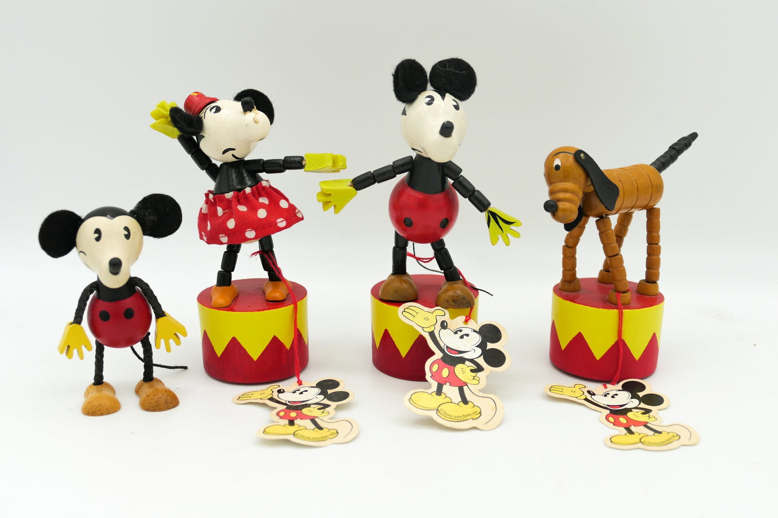 Retro Style Mickey and Pluto Push-Up Puppets: Retro style Mickey, Minnie and Pluto push-up puppets including 3 2002 Schylling Retro Collection Thumb Toys and 1 Schylling Mickey Mouse figurine. Some scratches and staining. Size: Tallest 5"h