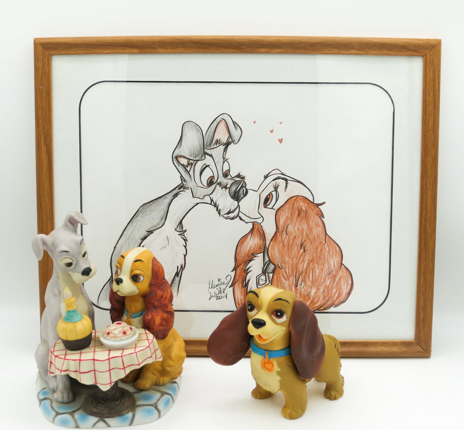 Lady and the Tramp Collectibles: Lady and the Tramp collectibles including a 2014 sketch by Monica Willis, single-matted in wood frame with artist info on back, vintage Walt Disney Productions ceramic figurine of spaghetti scene