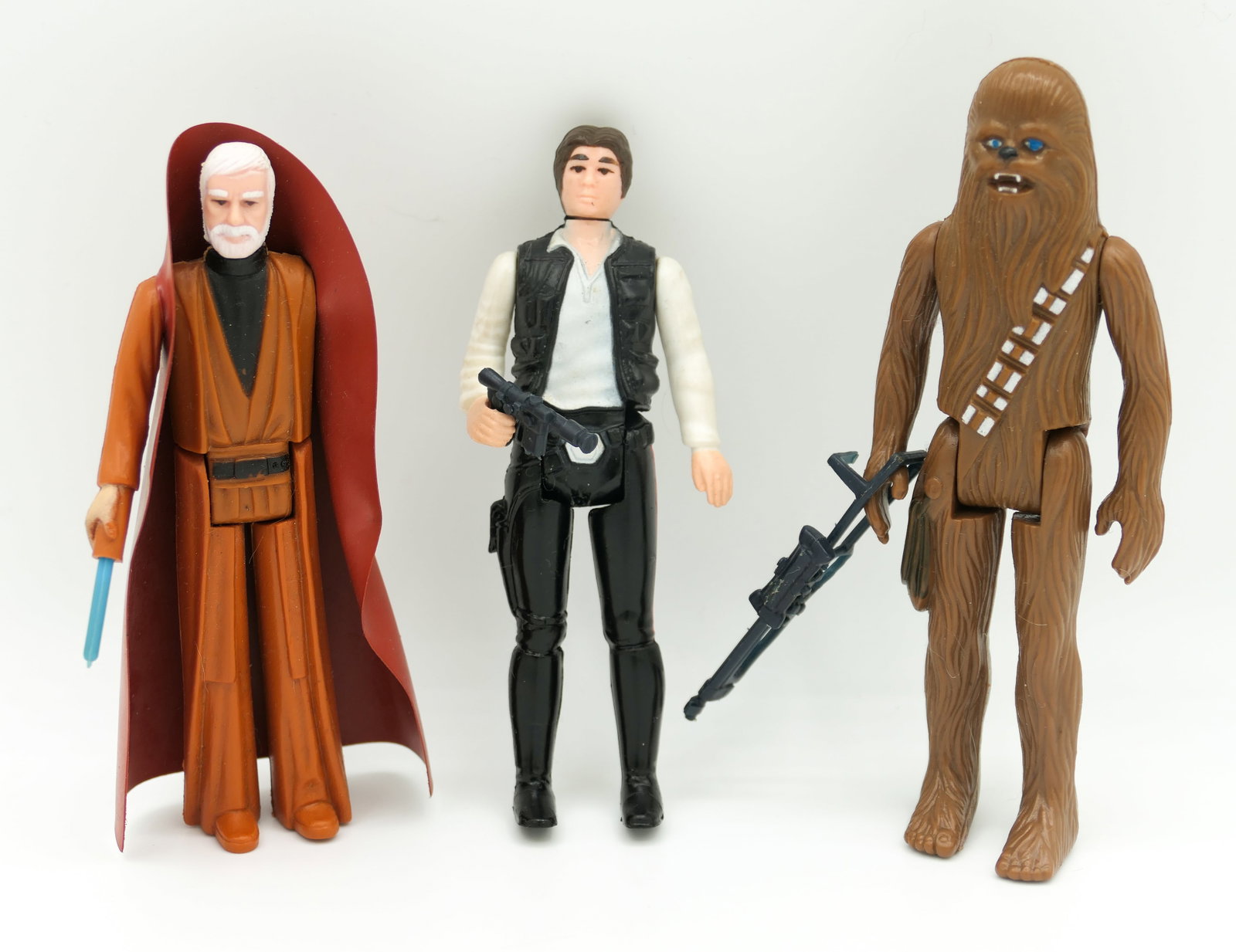 1977 Star Wars Action Figures: Three 1977 Kenner Star Wars action figures including Han Solo, Chewbacca and Ben Obi-Wan Kenobi. Size: Tallest 4.5"h
